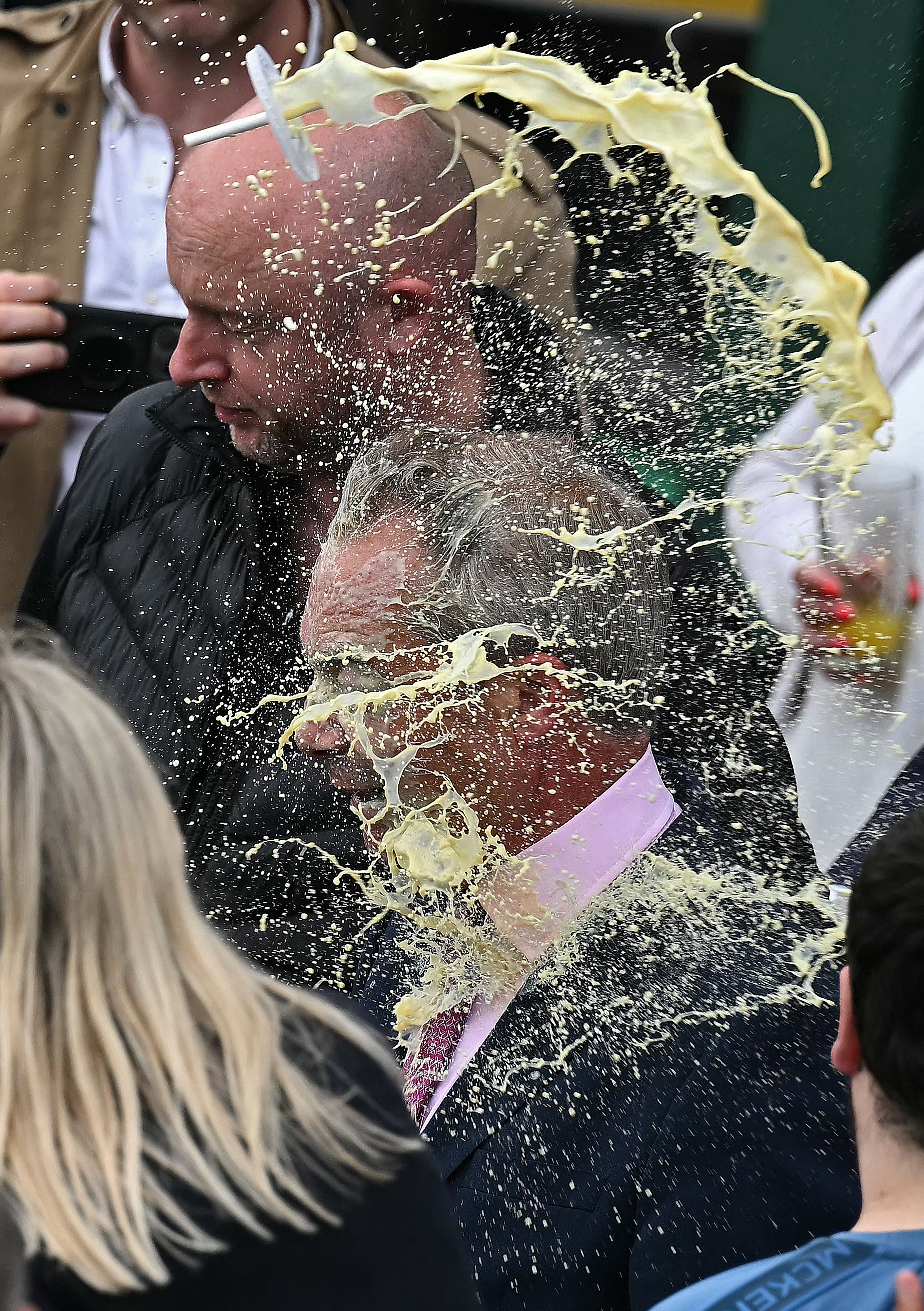 Mr Farage was drenched in the face by what appeared to be a milkshake