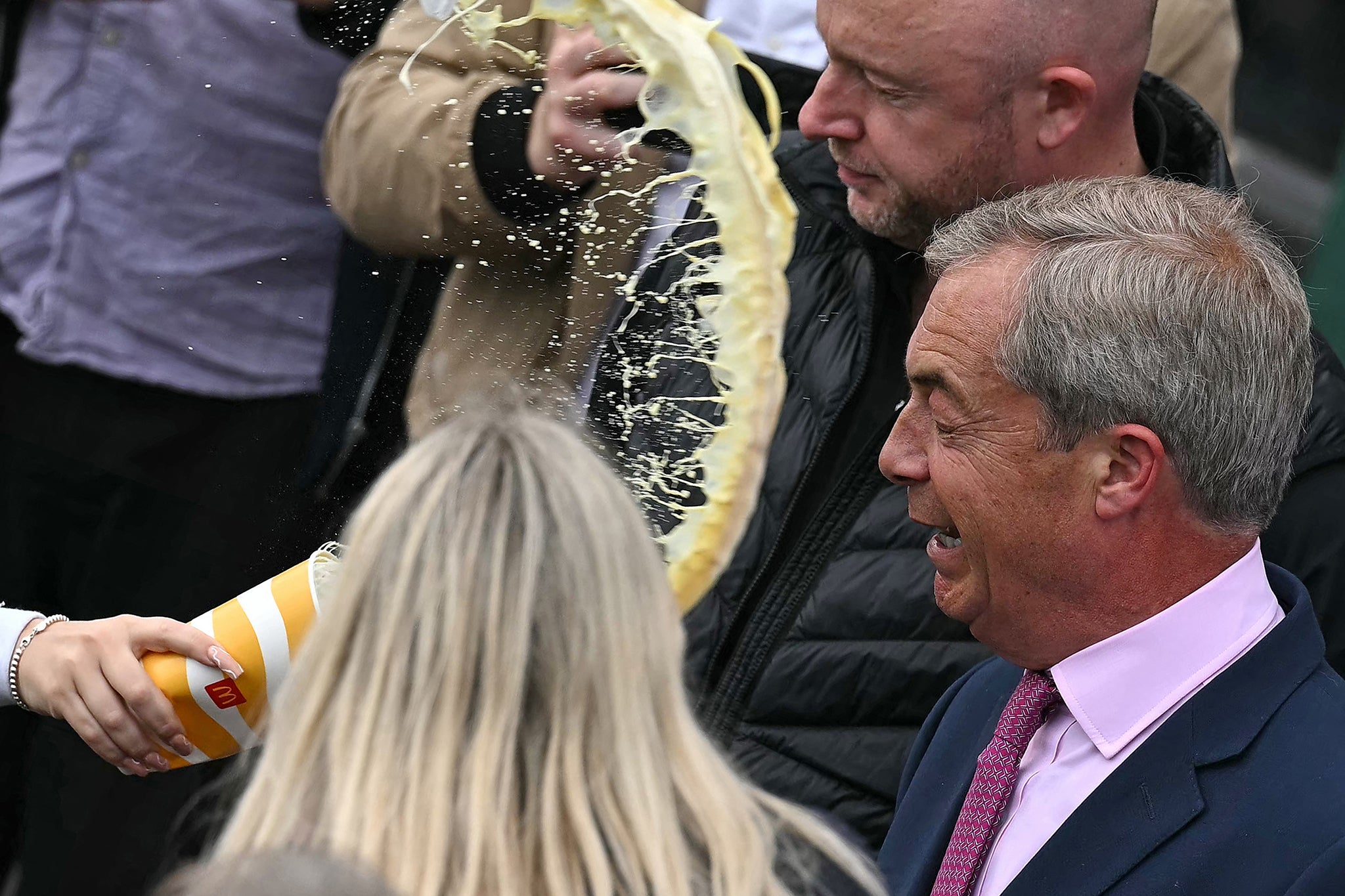 The Clacton MP was left with the yellow liquid splattered across his dark blue suit