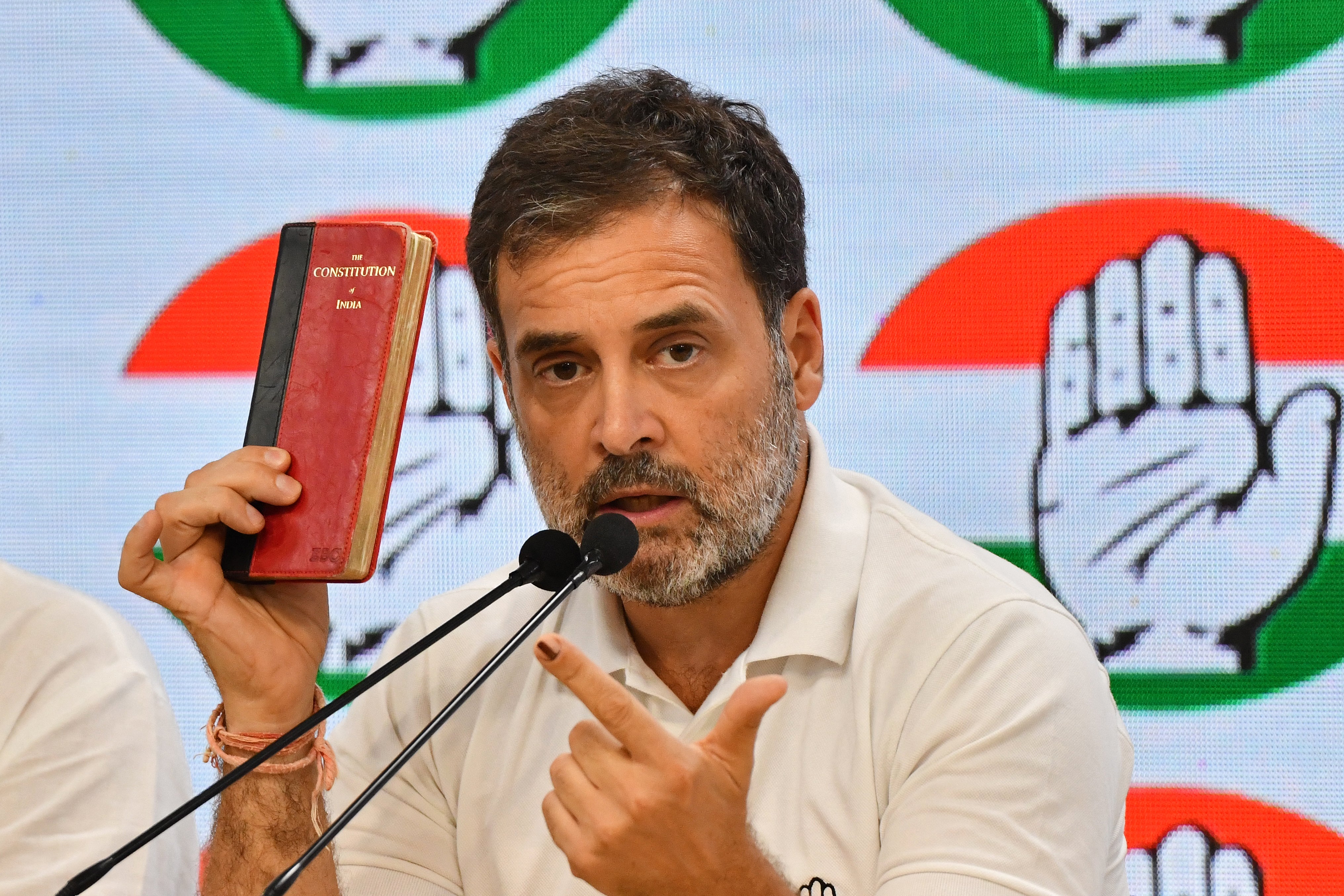 Rahul Gandhi with his copy of the Indian constitution at the Congress party headquarters in New Delhi