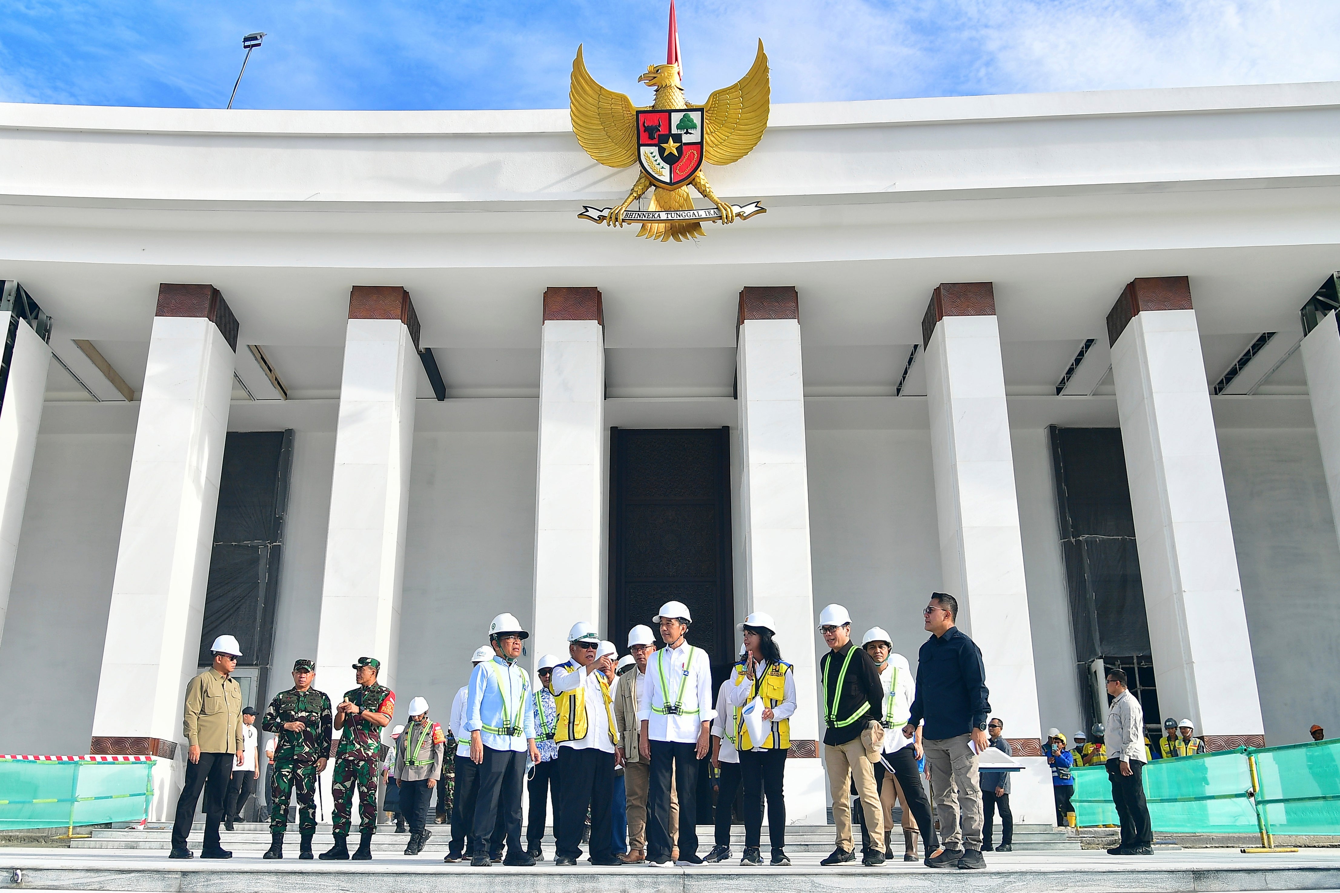 In this photo released by Indonesian Presidential Palace, Indonesian President Joko Widodo, center, inspects the presidential palace construction site at the new capital city Nusantara in Penajam Paser Utara, East Kalimantan, Indonesia, Wednesday, June 5, 2024