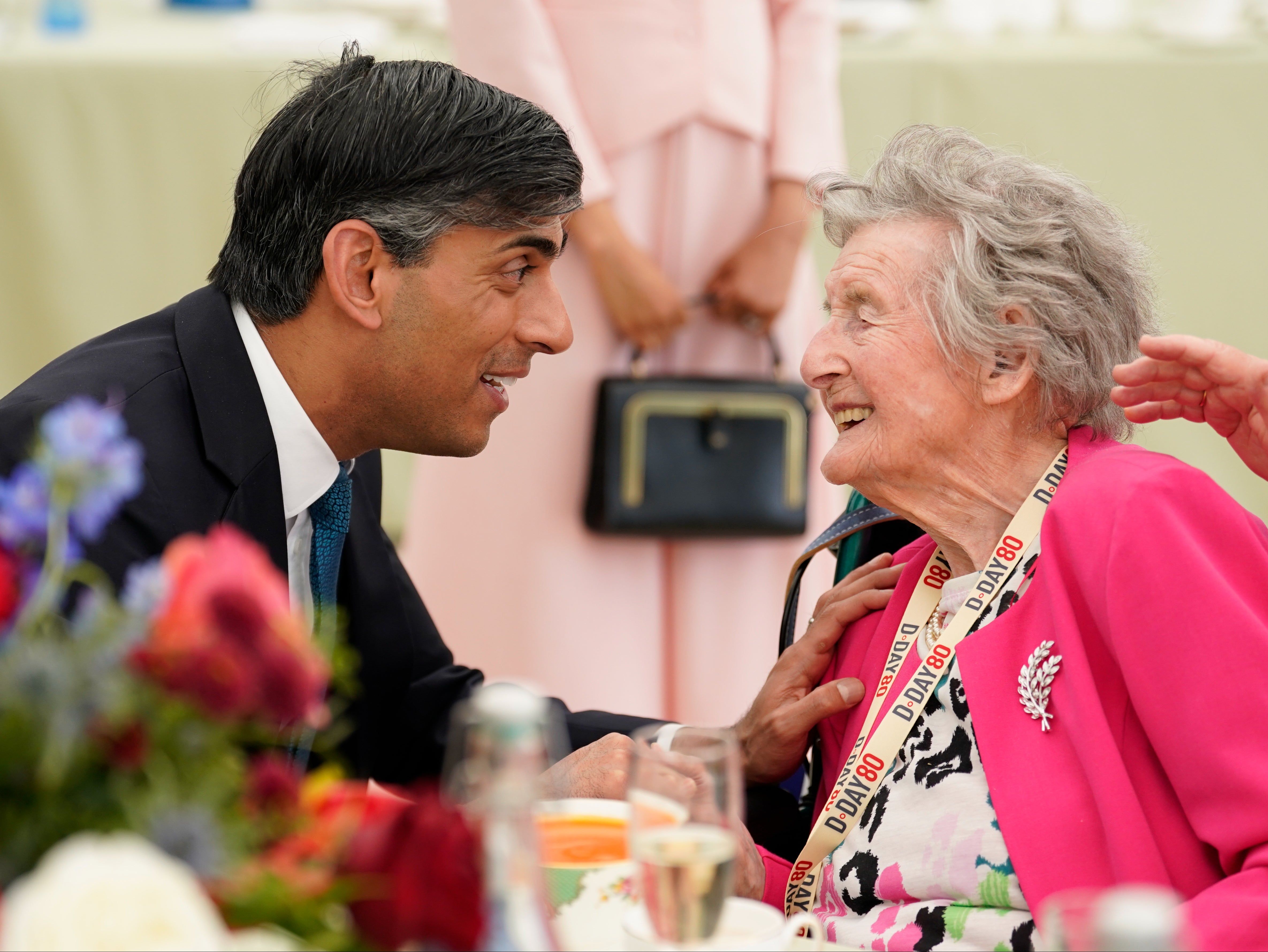 Prime Minister Rishi Sunak meets 100-year-old Wren veteran Marjorie Hutchens during a lunch for veterans and VIPs