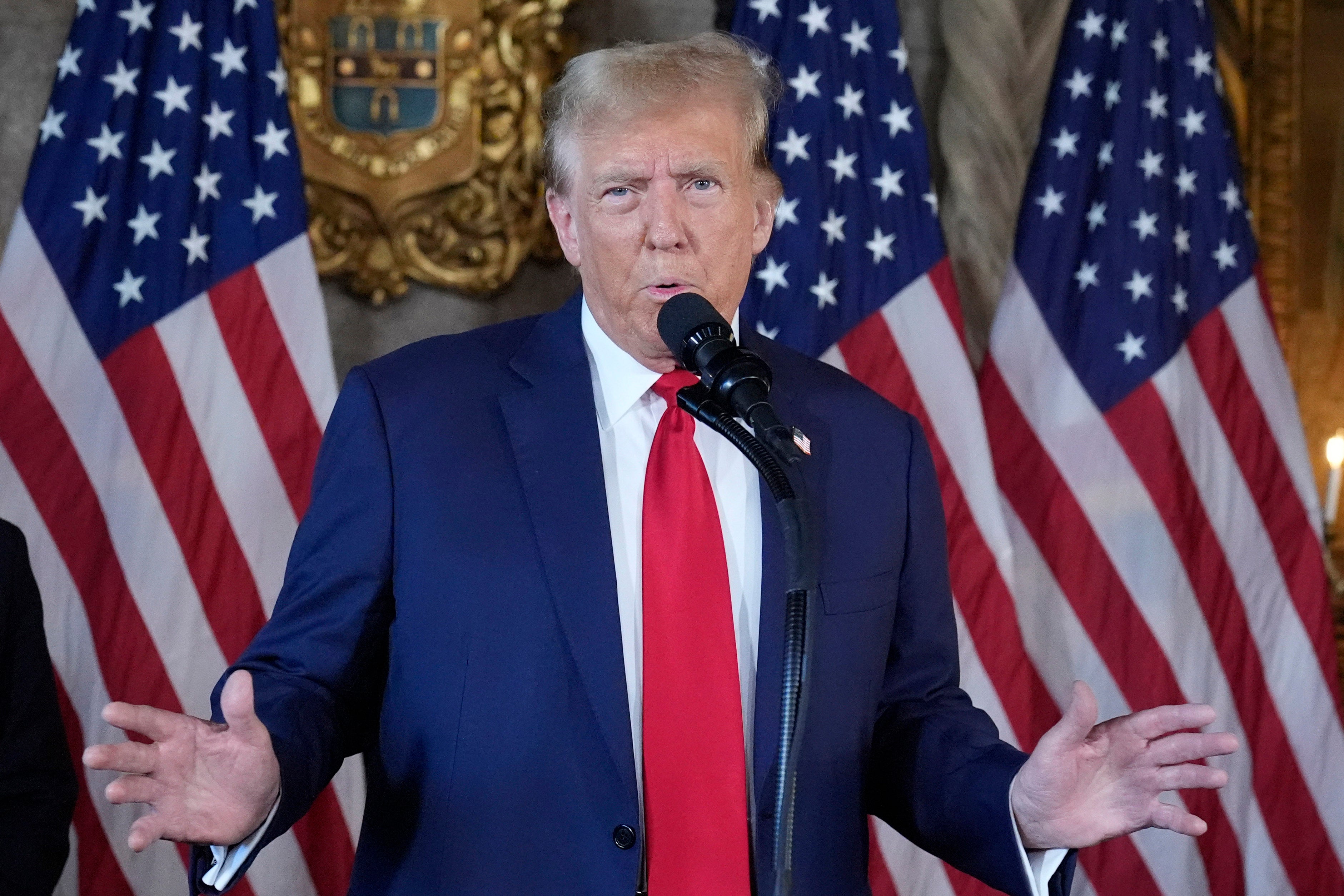 Donald Trump speaks to reporters at his Mar-a-Lago compound on April 12.