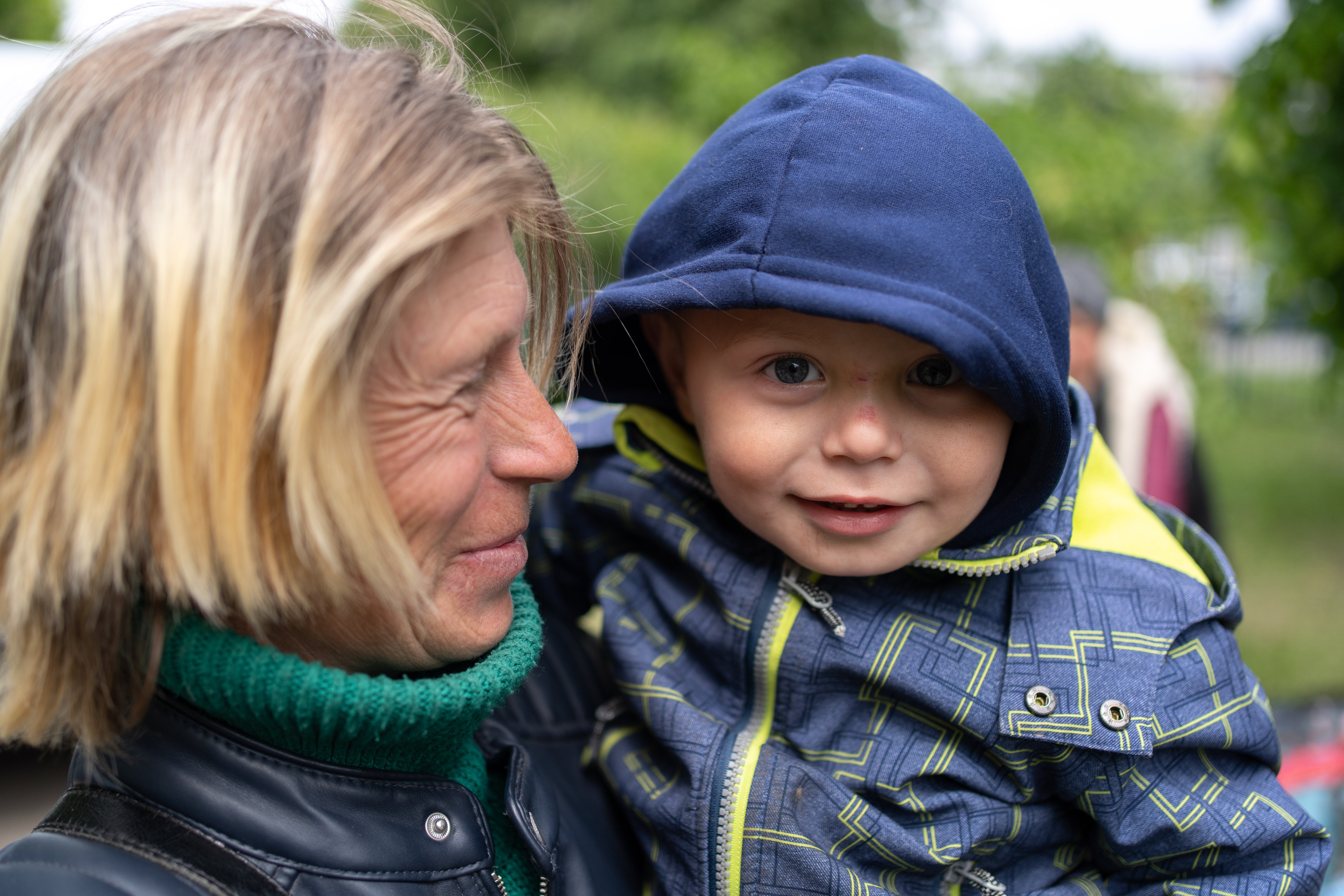 Valentyna and her son Matviy manage a smile in Kharkiv, after a terrifying day fleeing their hometown