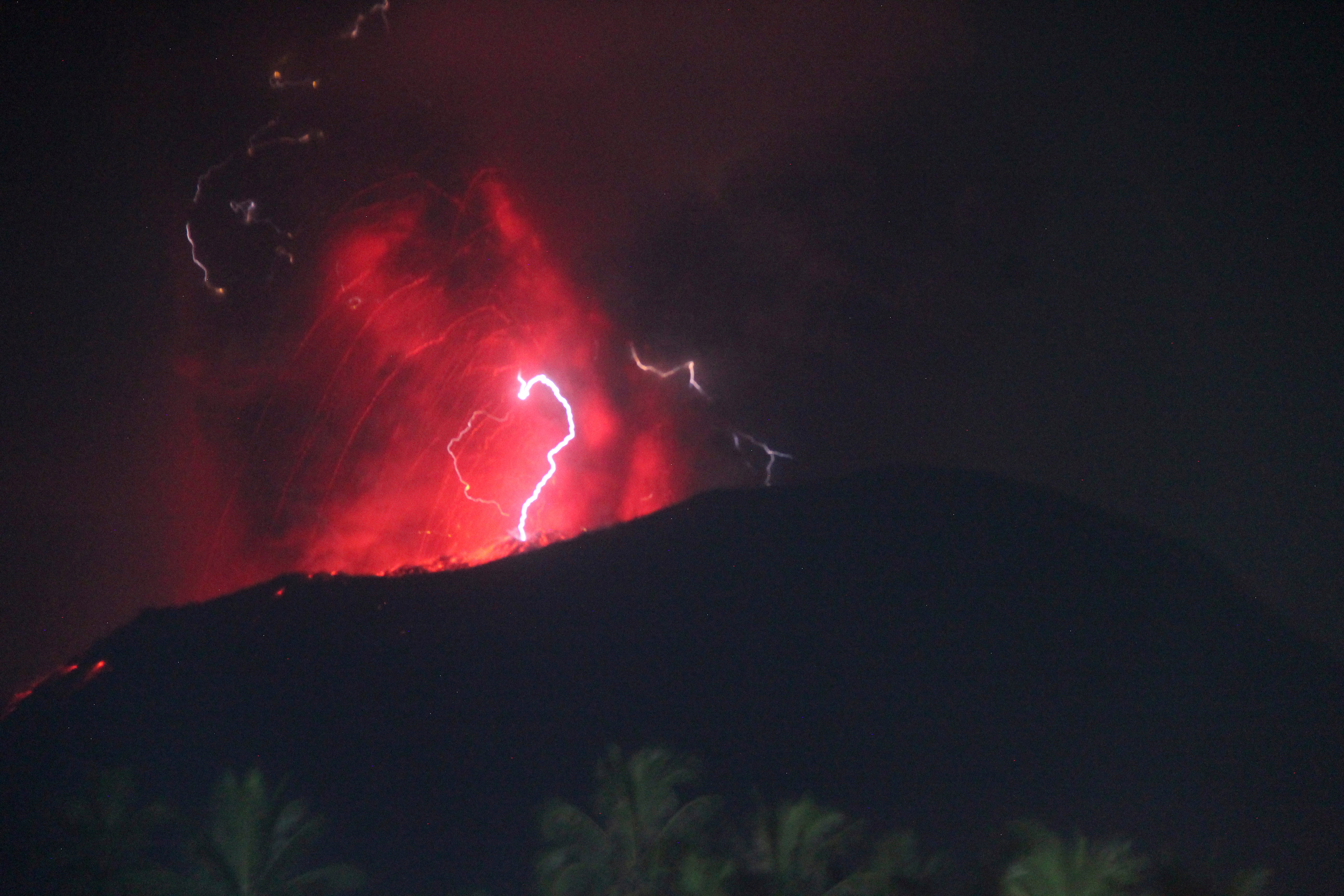 Indonesia’s Mount Ibu erupts 3 times, spewing lava and clouds of grey