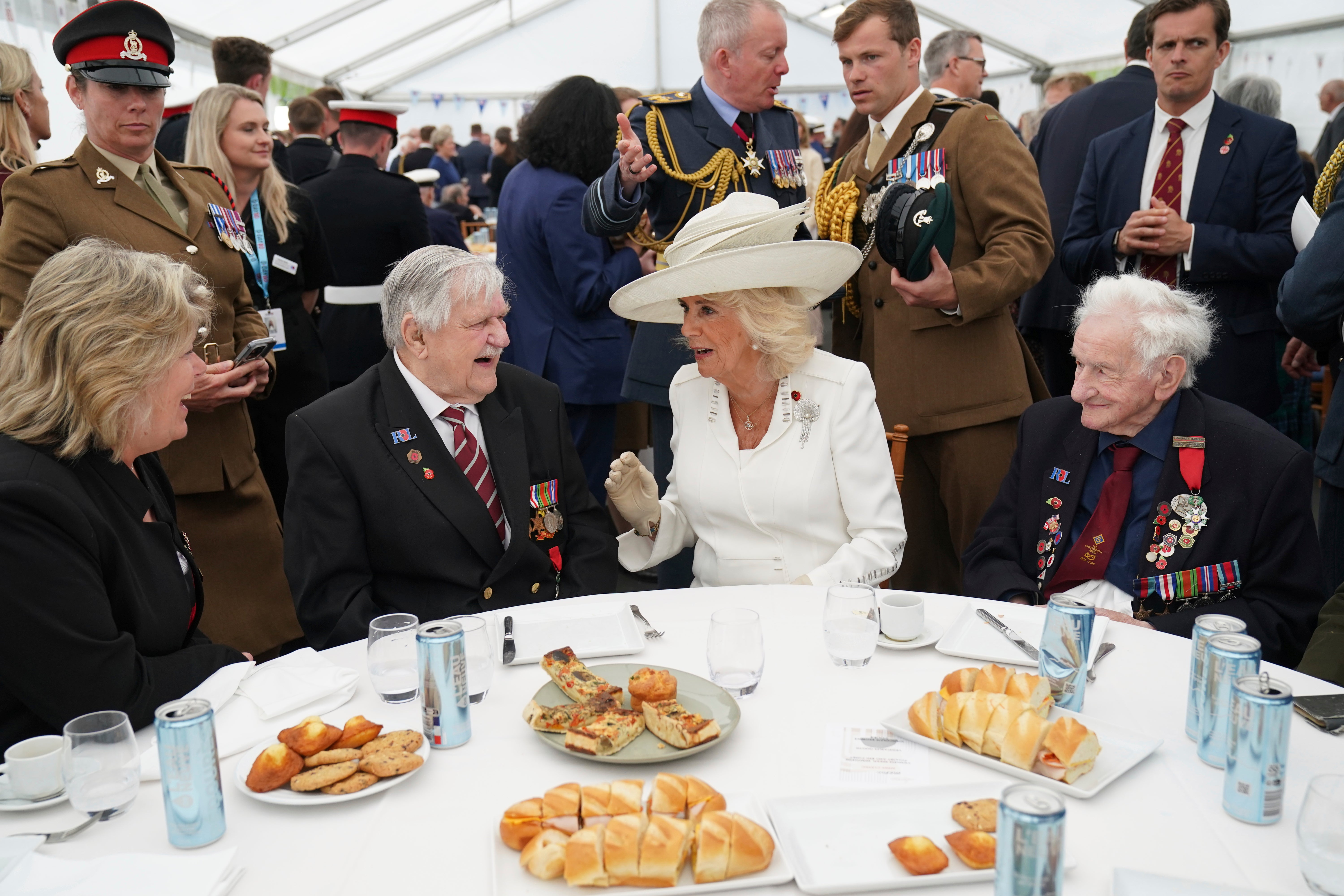 Queen Camilla speaks with veterans Arthur Oborne (left) and Albert Keir