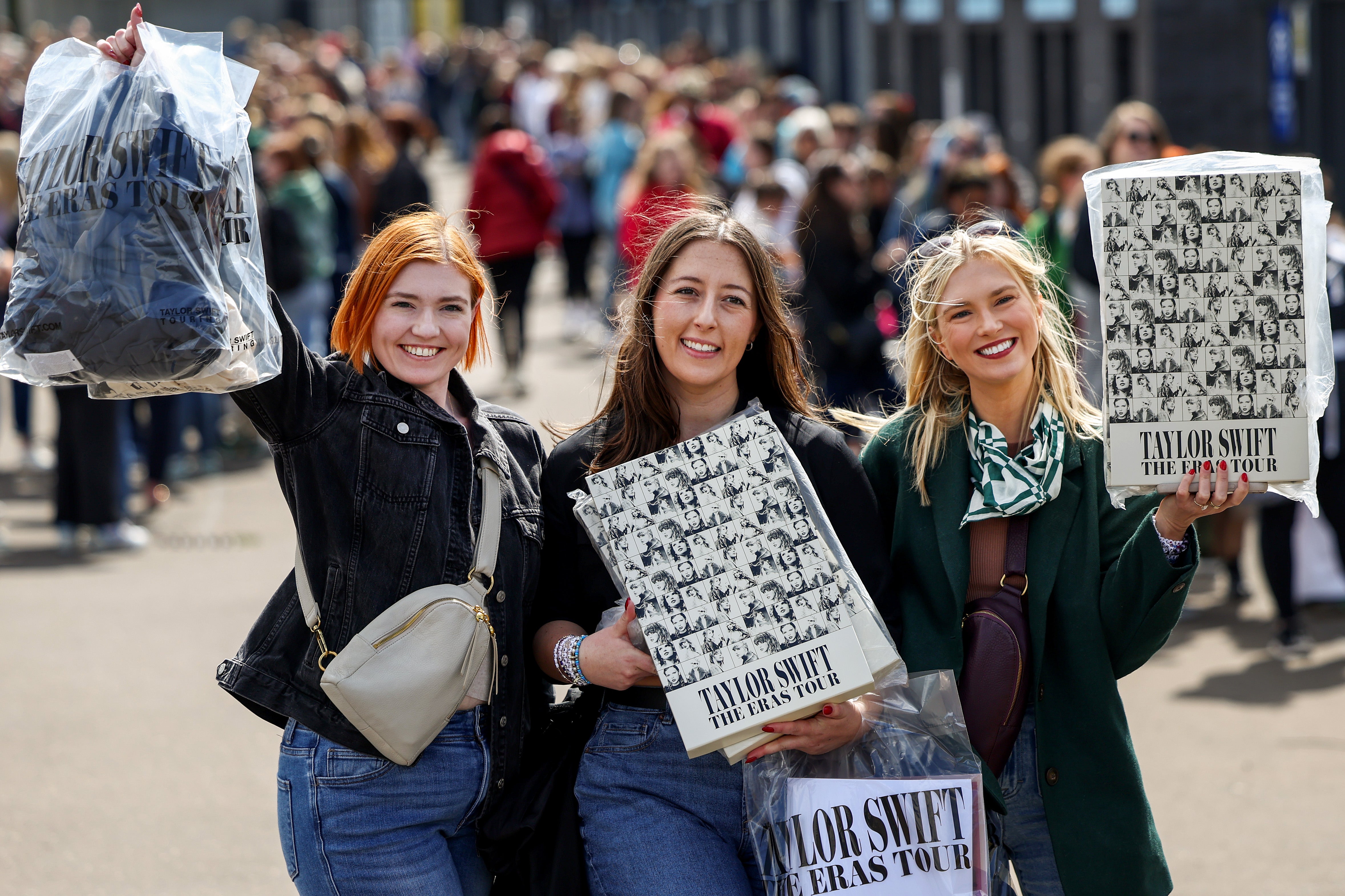 Swifties pose with their Taylor merch outside Murrayfield Stadium, Edinburgh