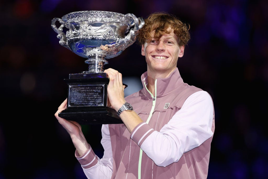 Sinner poses after winning the Australian Open