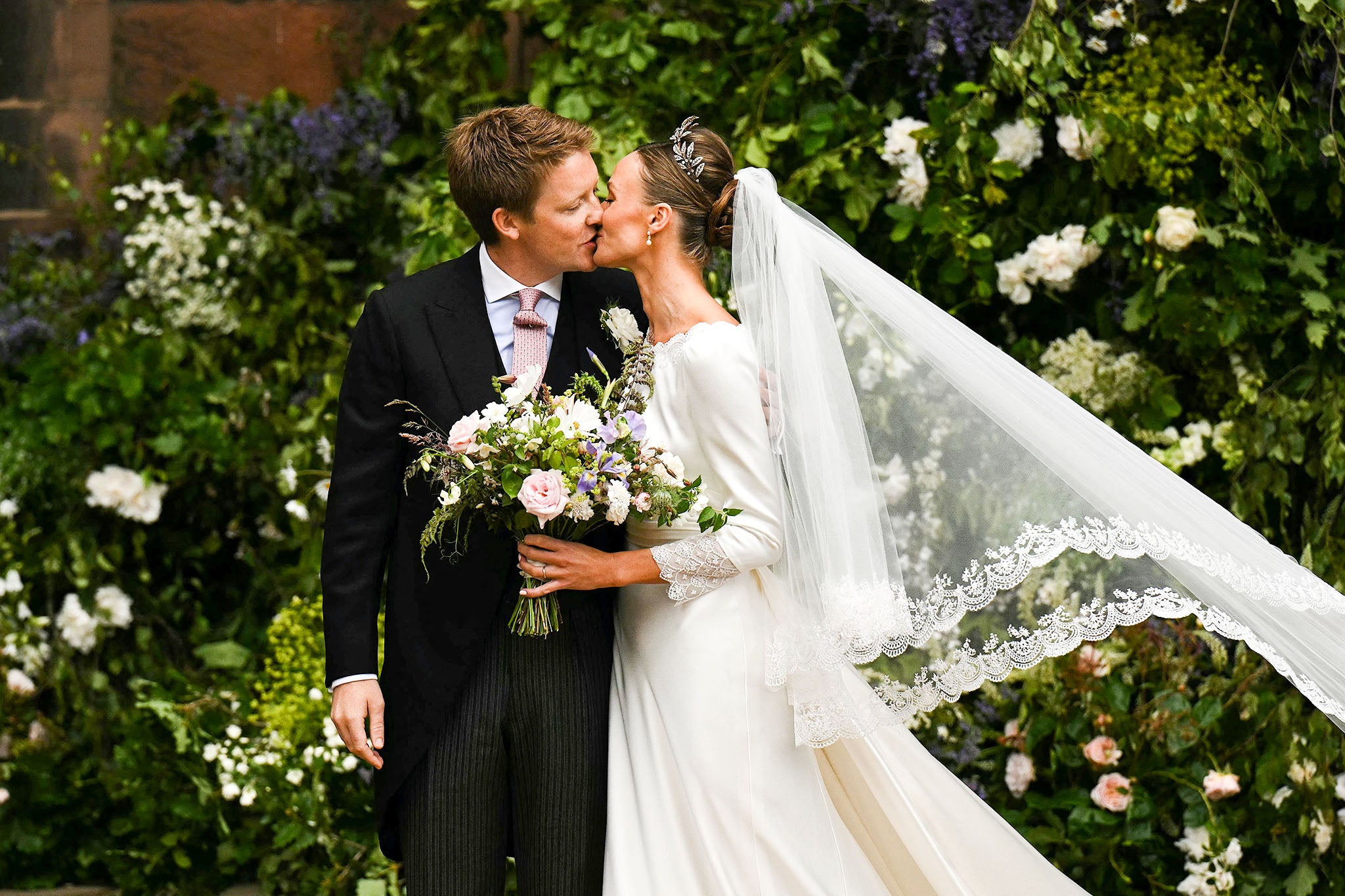 Hugh Grosvenor shares a kiss with Olivia Henson outside Chester Cathedral after tying the knot