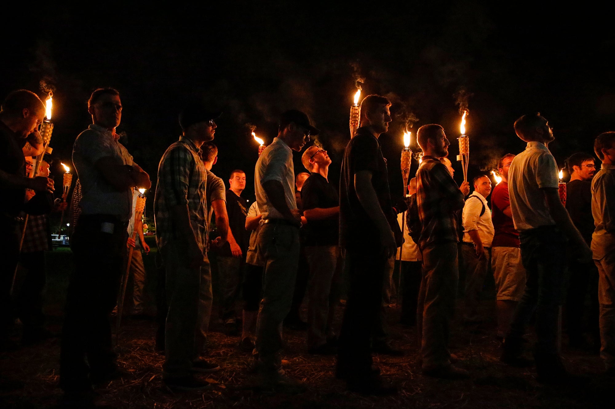 White nationalist groups marched through Charlottesville in August 2017 (pictured on night of August 11, 2017 )