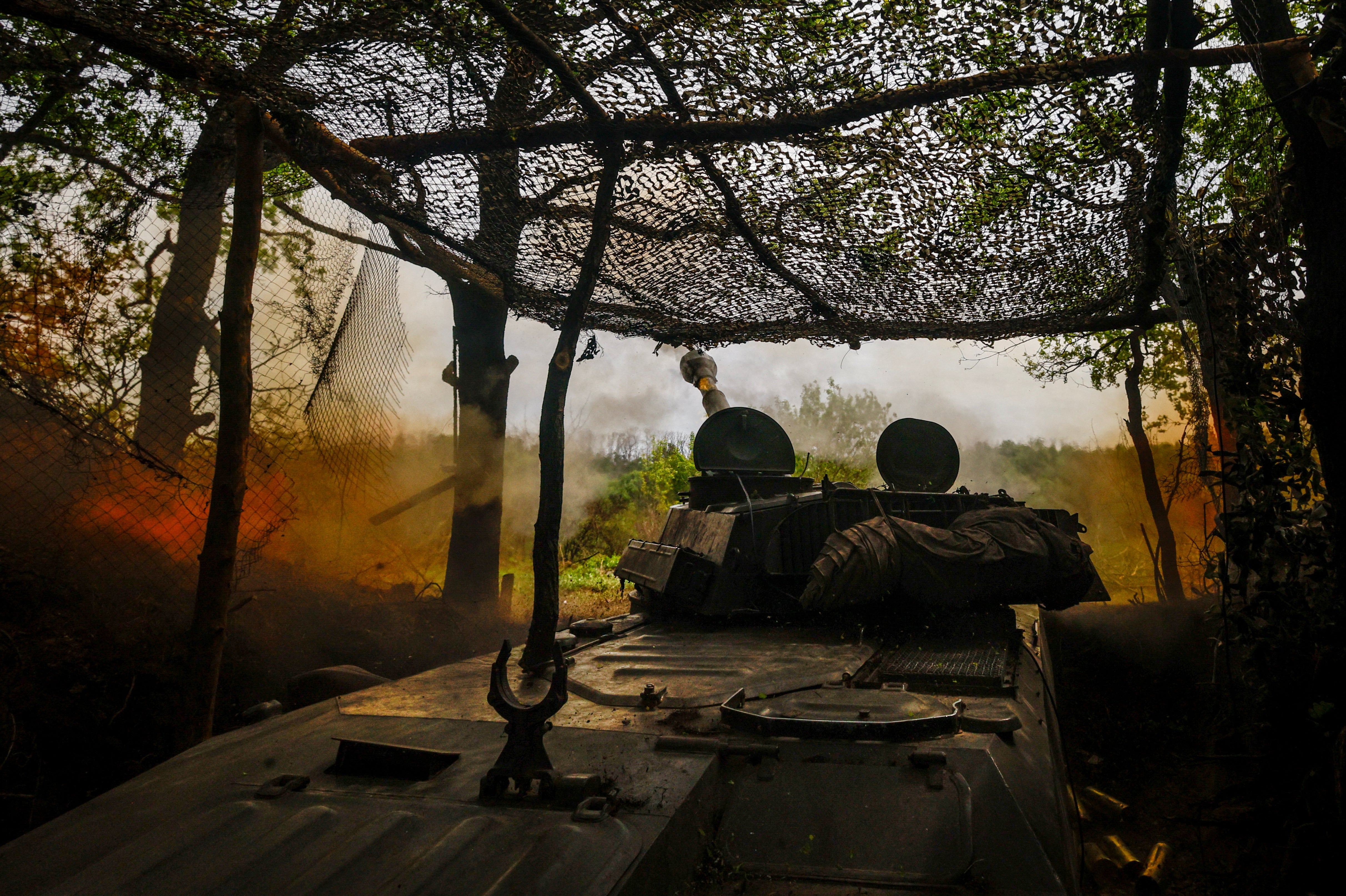 A self-propelled howitzer operated by Ukraine’s 57th Brigade fires in the direction of Russian positions on the outskirts of Kupiansk