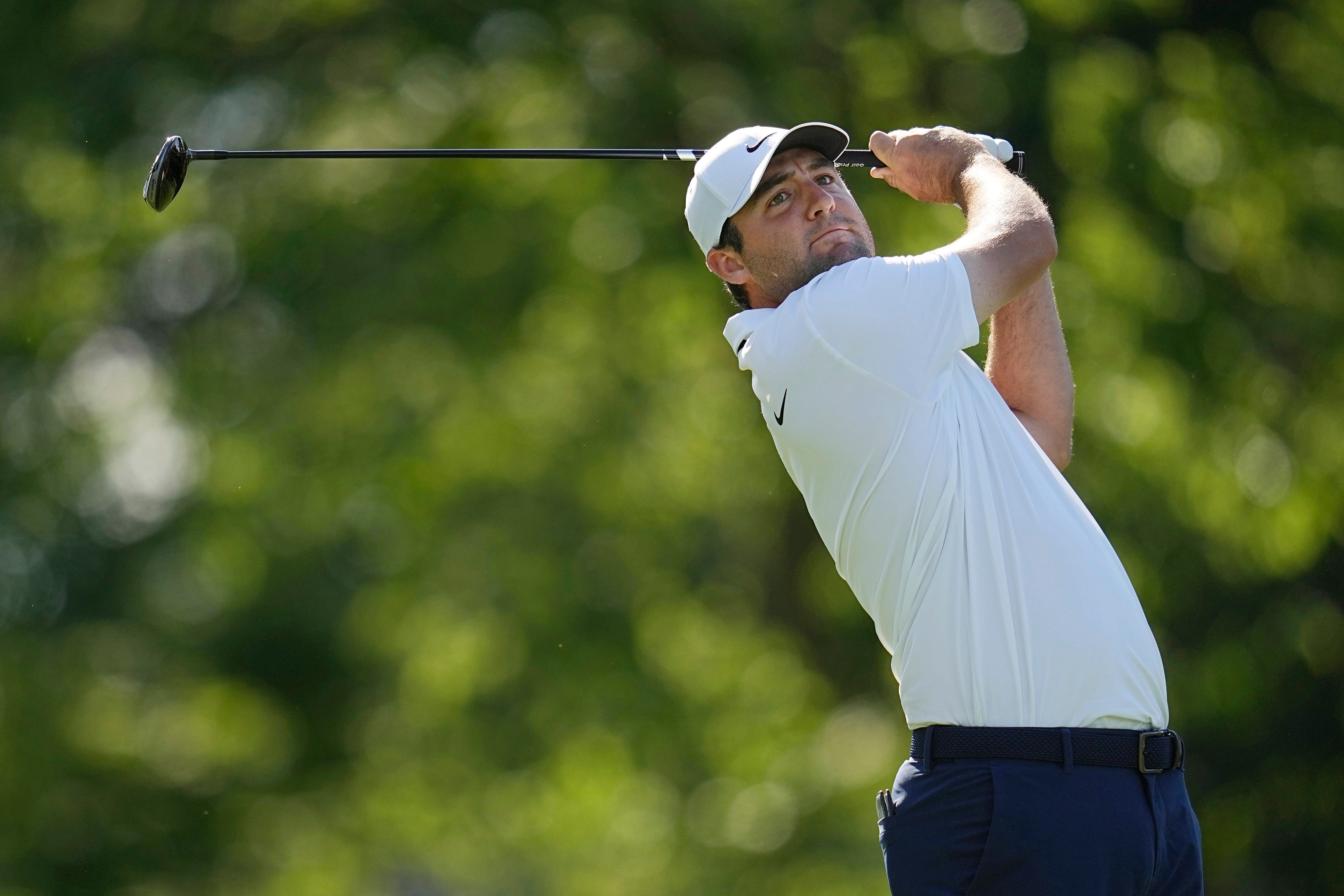 Scottie Scheffler watches his shot from the 18th tee during the second round of the Memorial Tournament (Sue Ogrocki/AP)