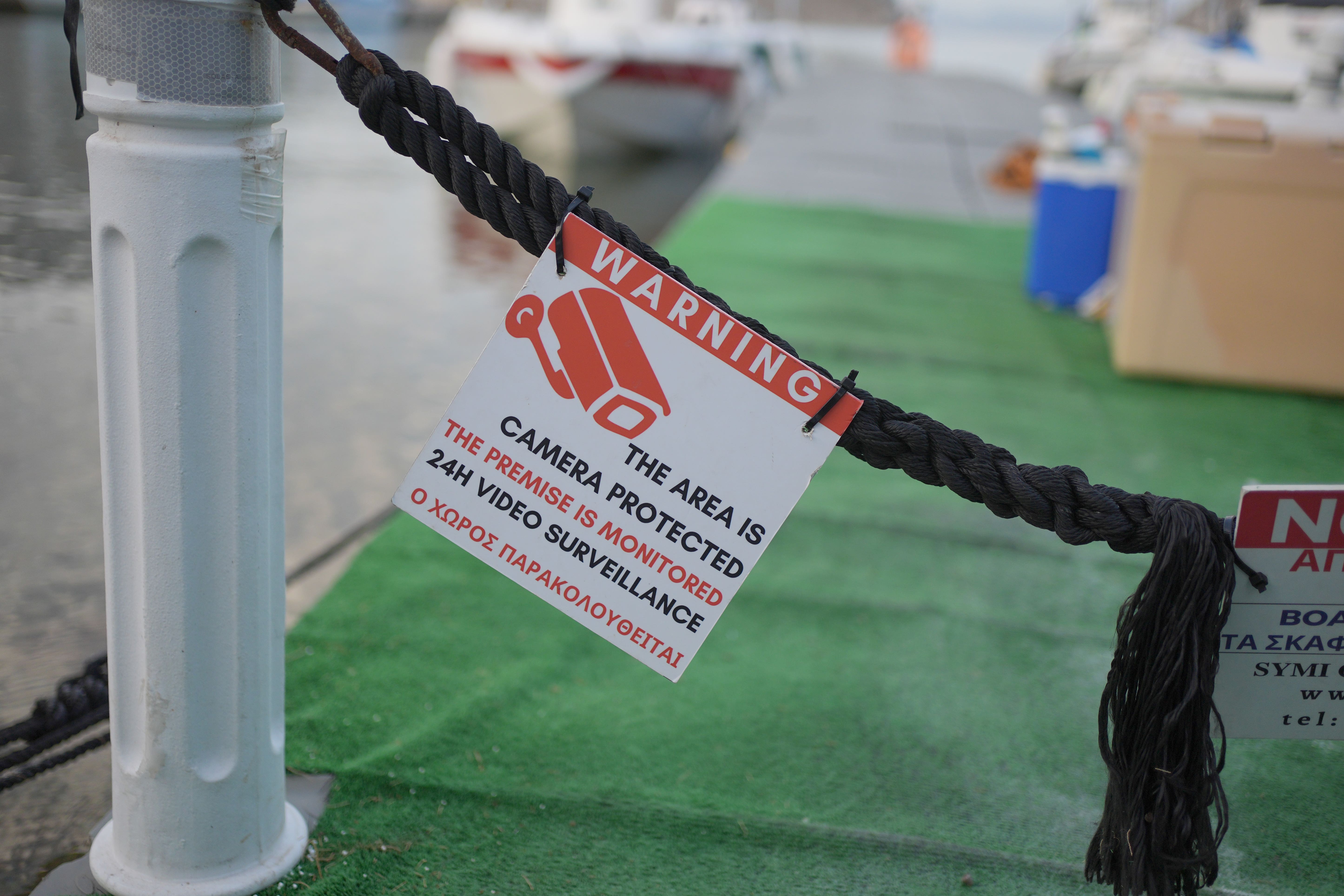 A CCTV sign on a jet boat in the Pedi district of Symi, Greece, where a search and rescue operation is under way for TV doctor and columnist Michael Mosley after he went missing while on holiday (Yui Mok/PA)