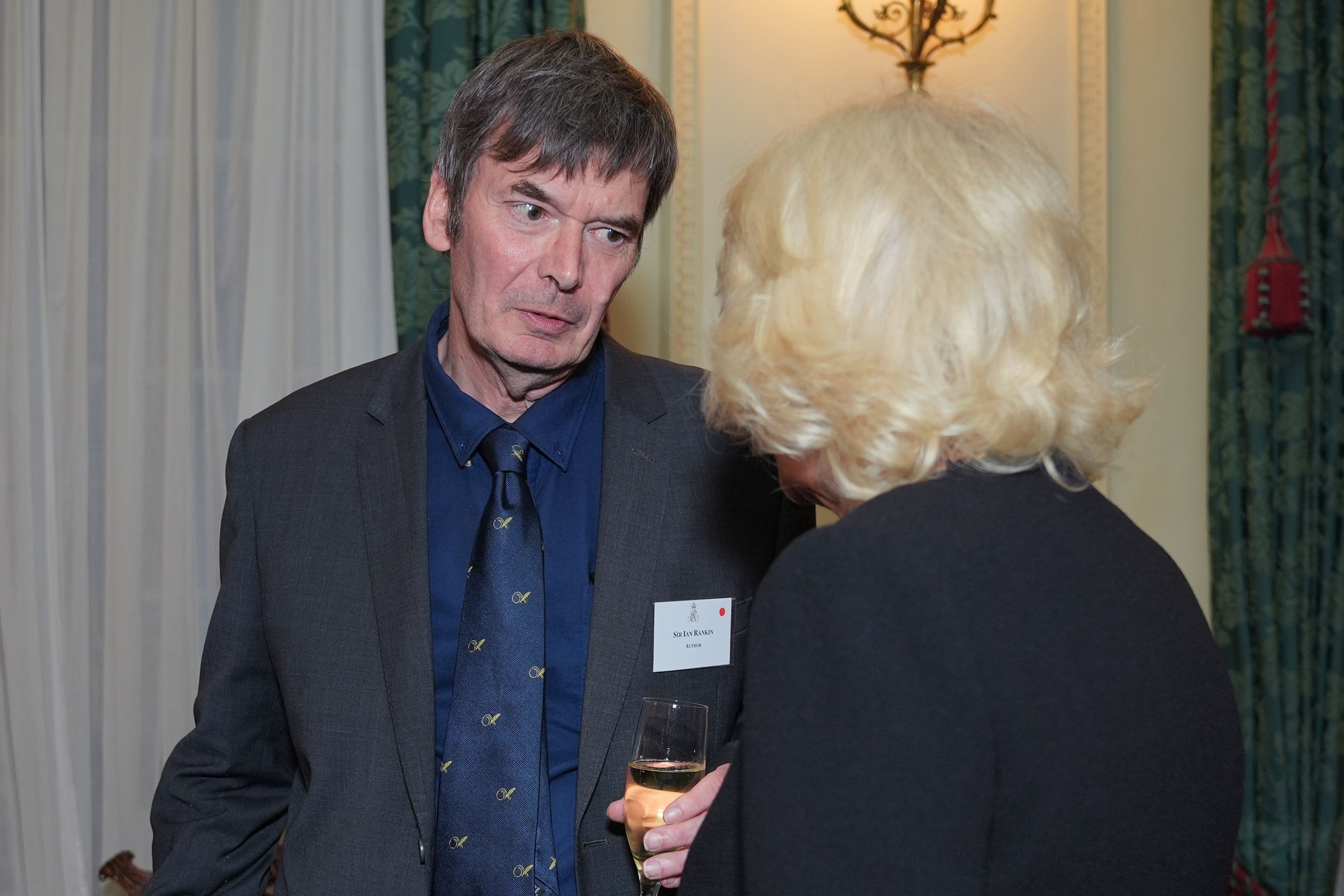 Queen Camilla with Sir Ian Rankin (Yui Mok/PA)