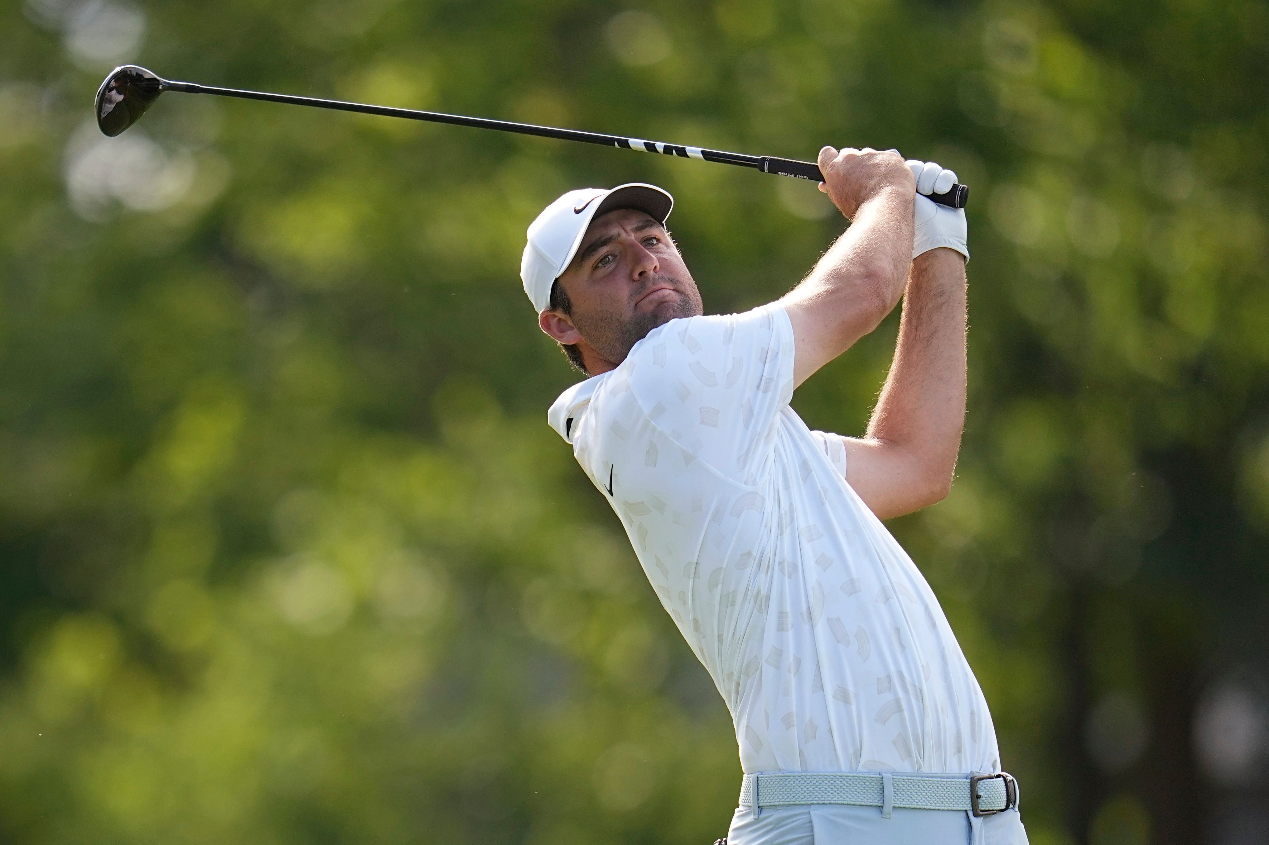 Scottie Scheffler watches his shot from the 18th tee (Sue Ogrocki/AP)