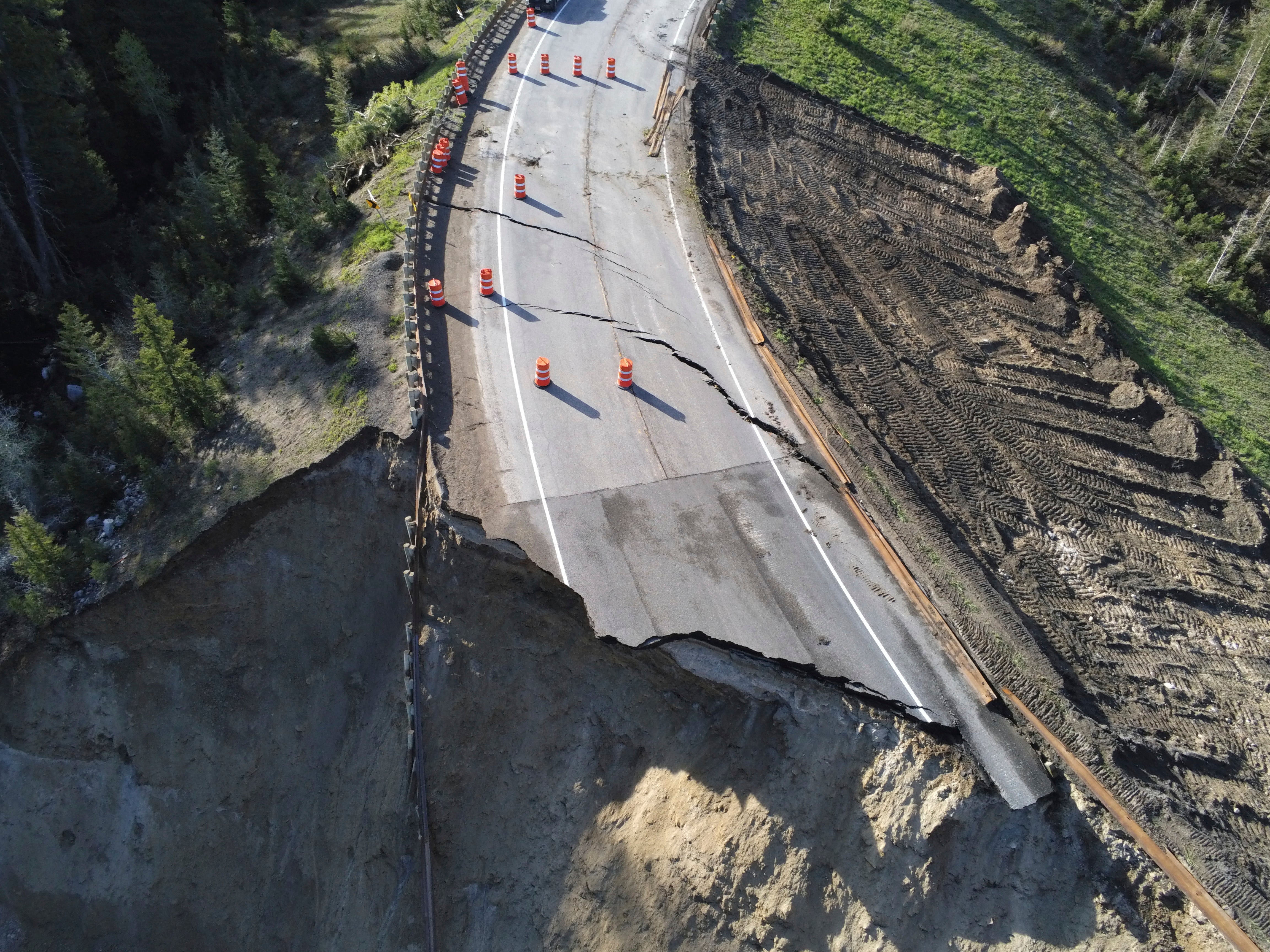 This photo provided by Wyoming Highway Patrol shows a damaged section of Teton Pass near Jackson