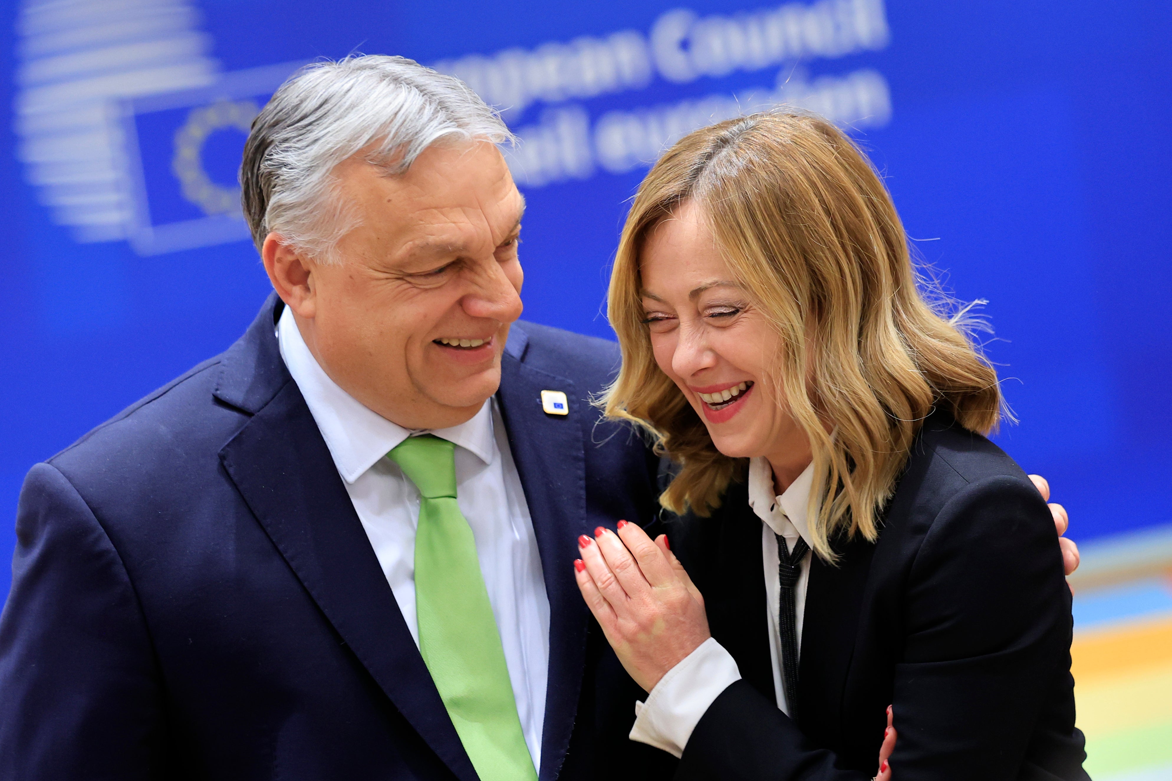 Hungary's prime minister Viktor Orban, left, speaks with Italy's premier Giorgia Meloni during a round table meeting at an EU Summit in Brussels. Right and far-right parties were the big winners in elections this week