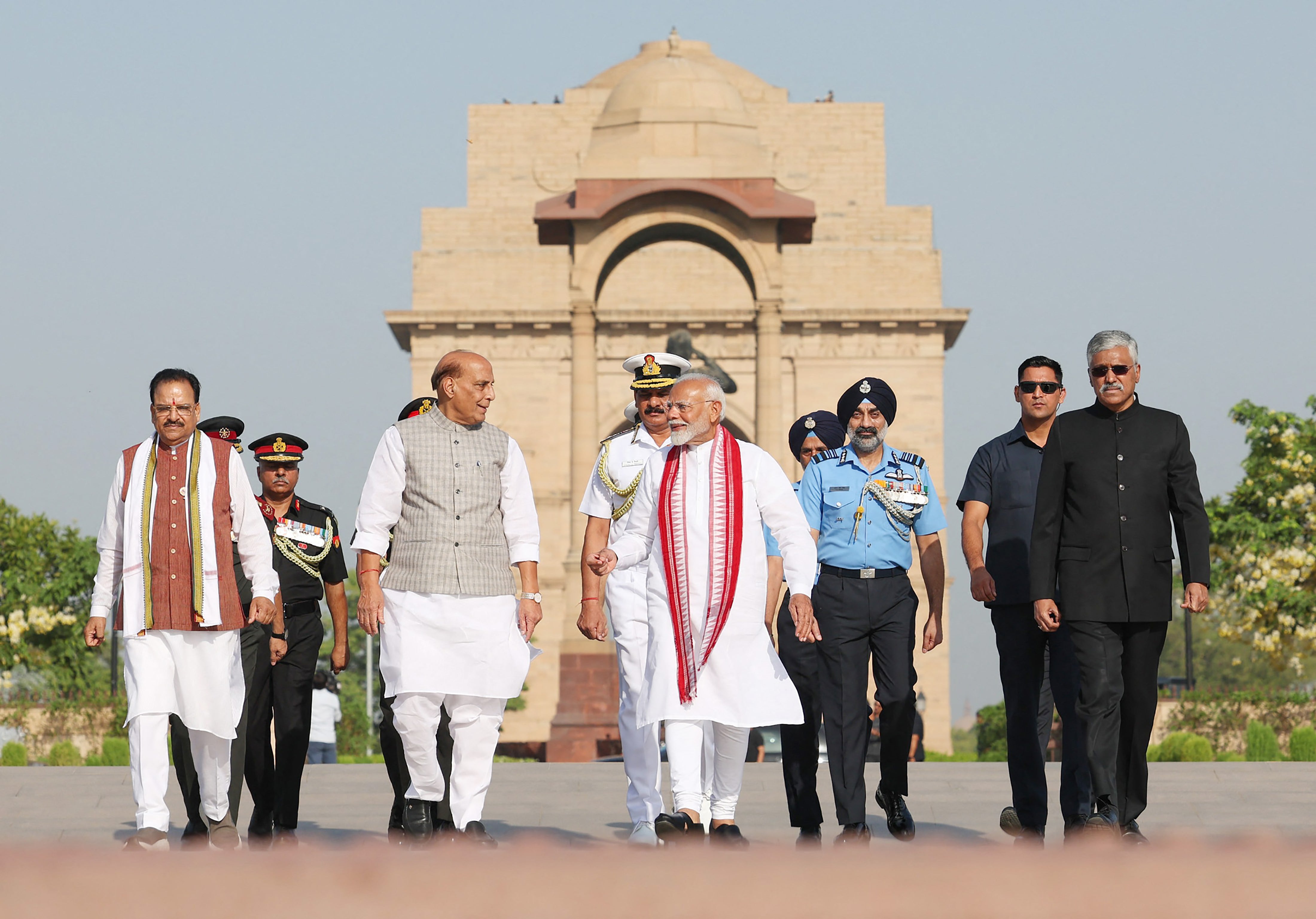 Modi (C) arrives to pay homage at the National War Memorial before his oath-taking ceremony for a third term in New Delhi