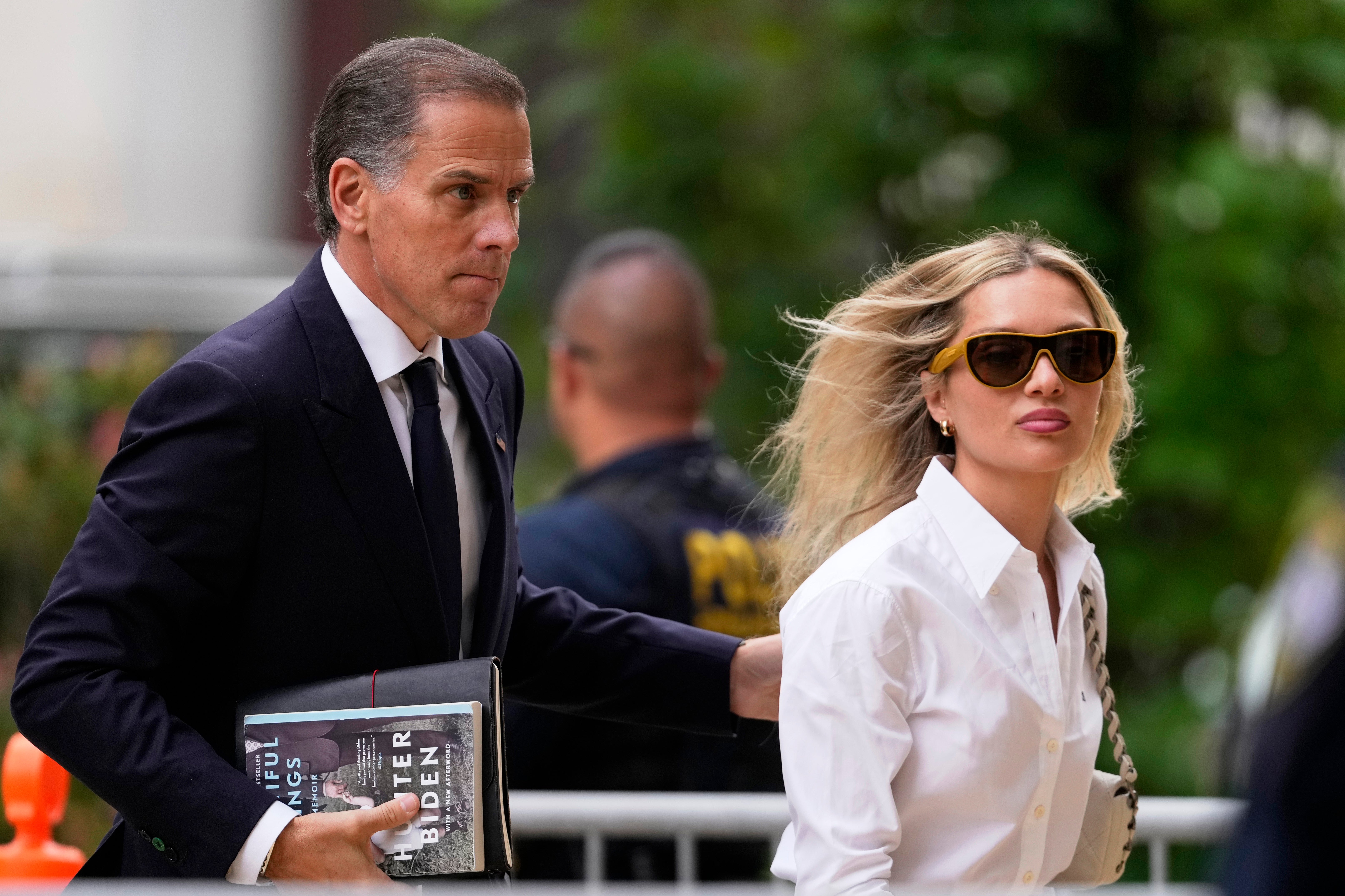 Hunter Biden, left, arrives at the federal court with his wife, Melissa Cohen Biden, June 6, 2024, in Wilmington