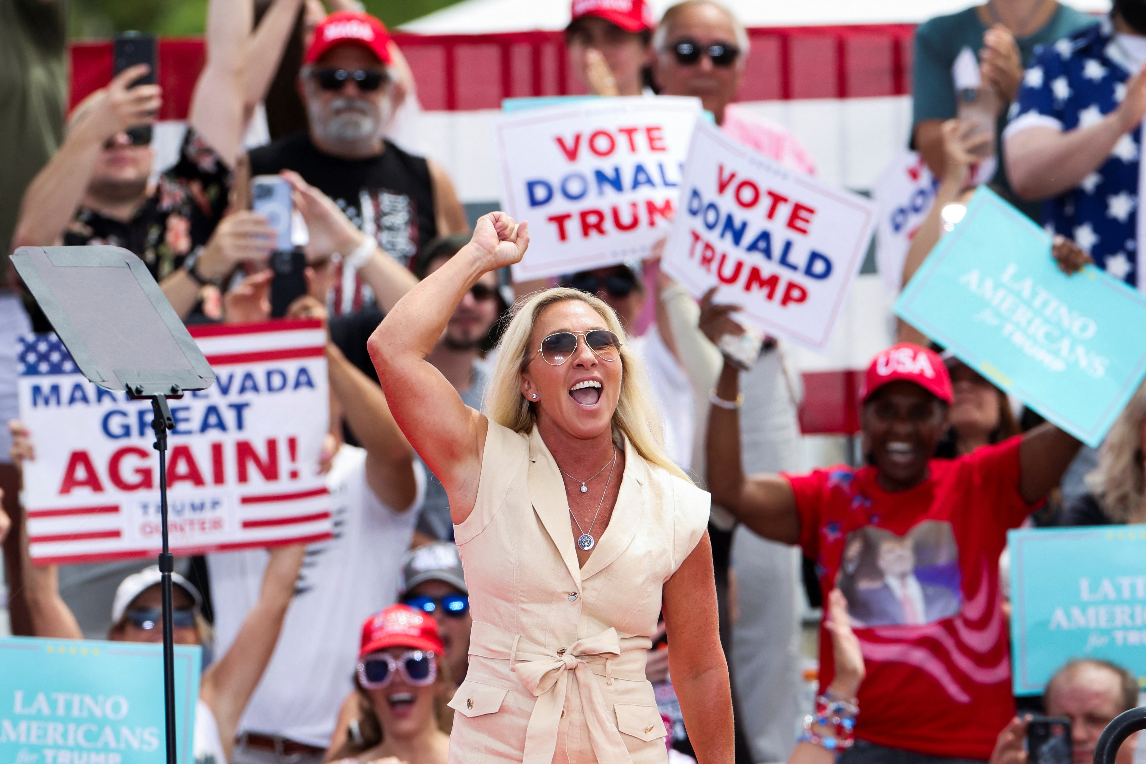 U.S. Rep. Marjorie Taylor Greene (R-GA) gestures as people wait for Republican presidential candidate and former U.S. President Donald Trump to attend a campaign event in Las Vegas, Nevada, U.S.