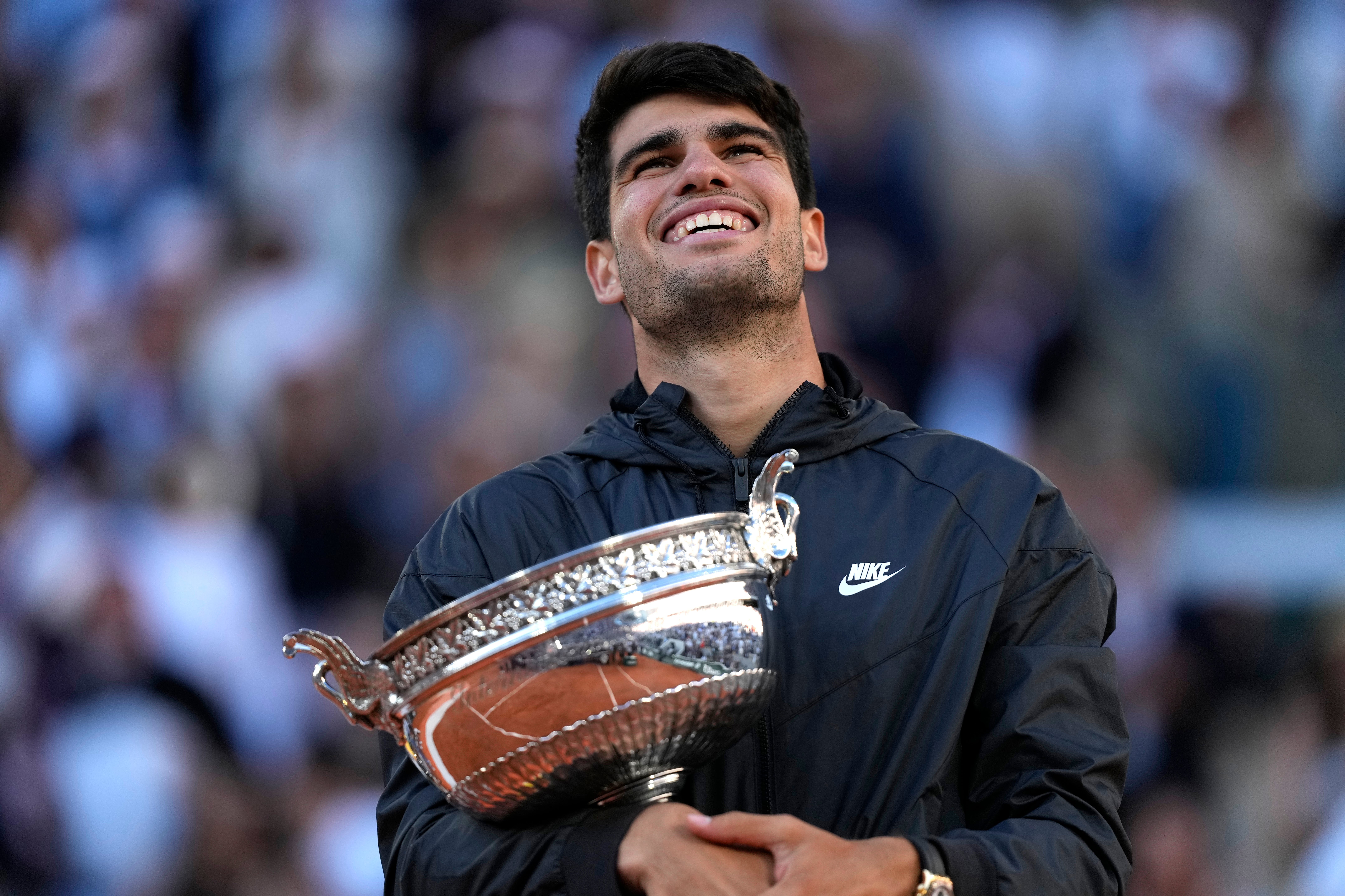 Carlos Alcaraz, pictured celebrating his French Open win, wants to emulate Novak Djokovic’s 24 Grand Slam titles haul (Thibault Camus/AP)