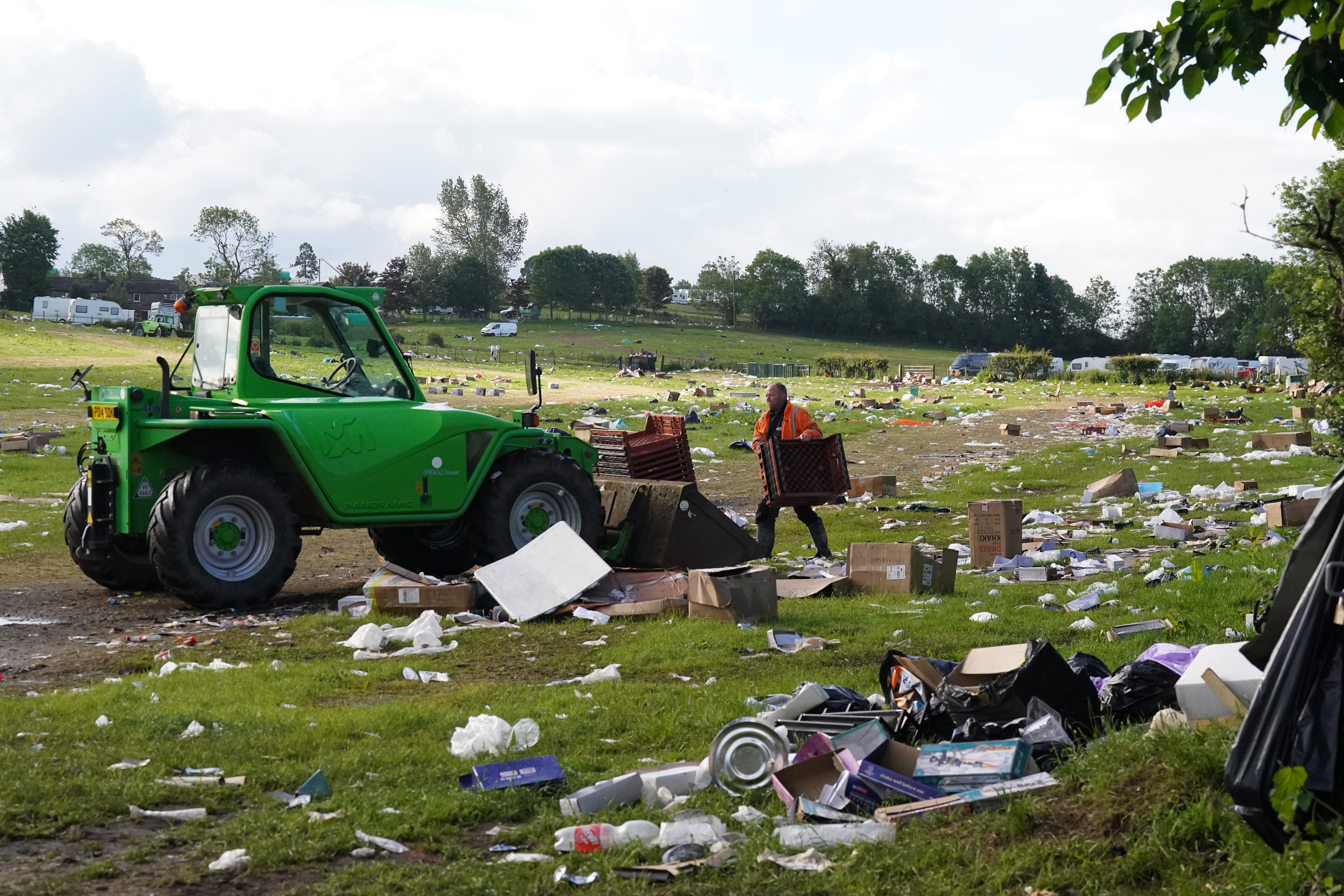 Pictures from the site in Appleby-in-Westmorland, Cumbria, show clean-up teams tackling fields of rubbish left behind