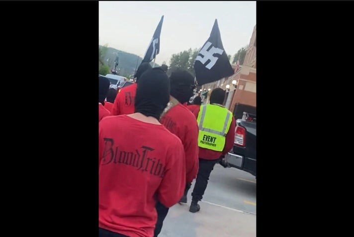 A neo-Nazi group displayed a Nazi flag on the steps of South Dakota’s state capitol as they held rallies in the state.