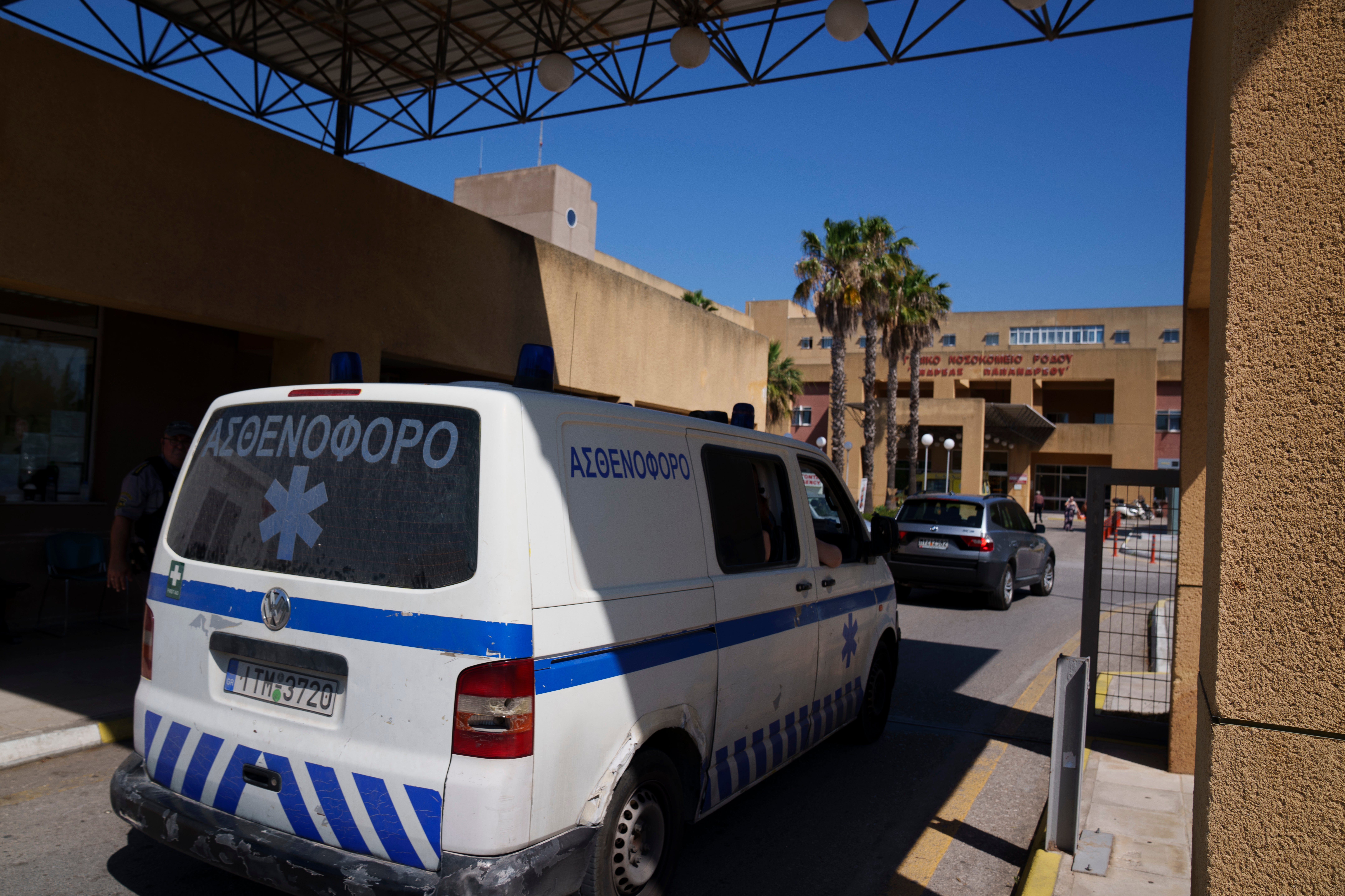 An ambulance drives through the entrance of a hospital on the island of Rhodes, where Mosley’s body was taken following his death