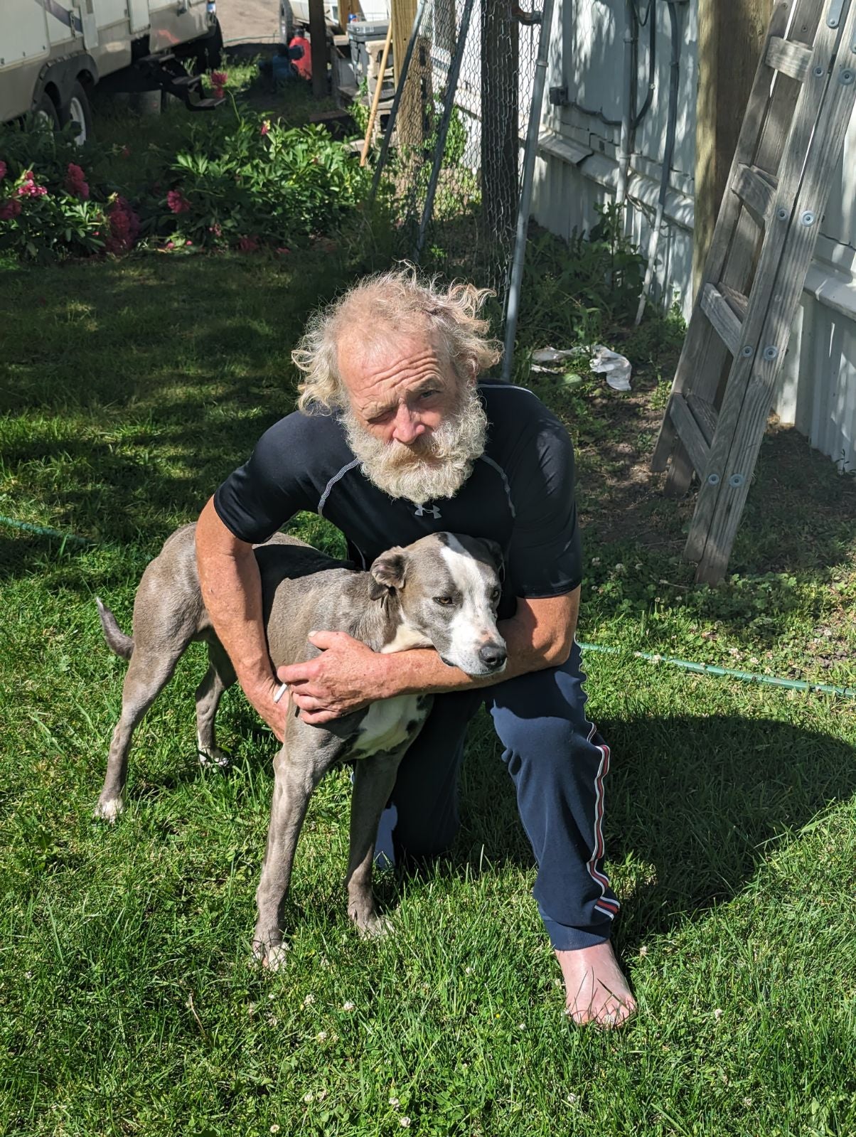 Baker County Sheriff’s Office published a photo of Brandon Garrett and his dog ‘Blue’ on their Facebook page