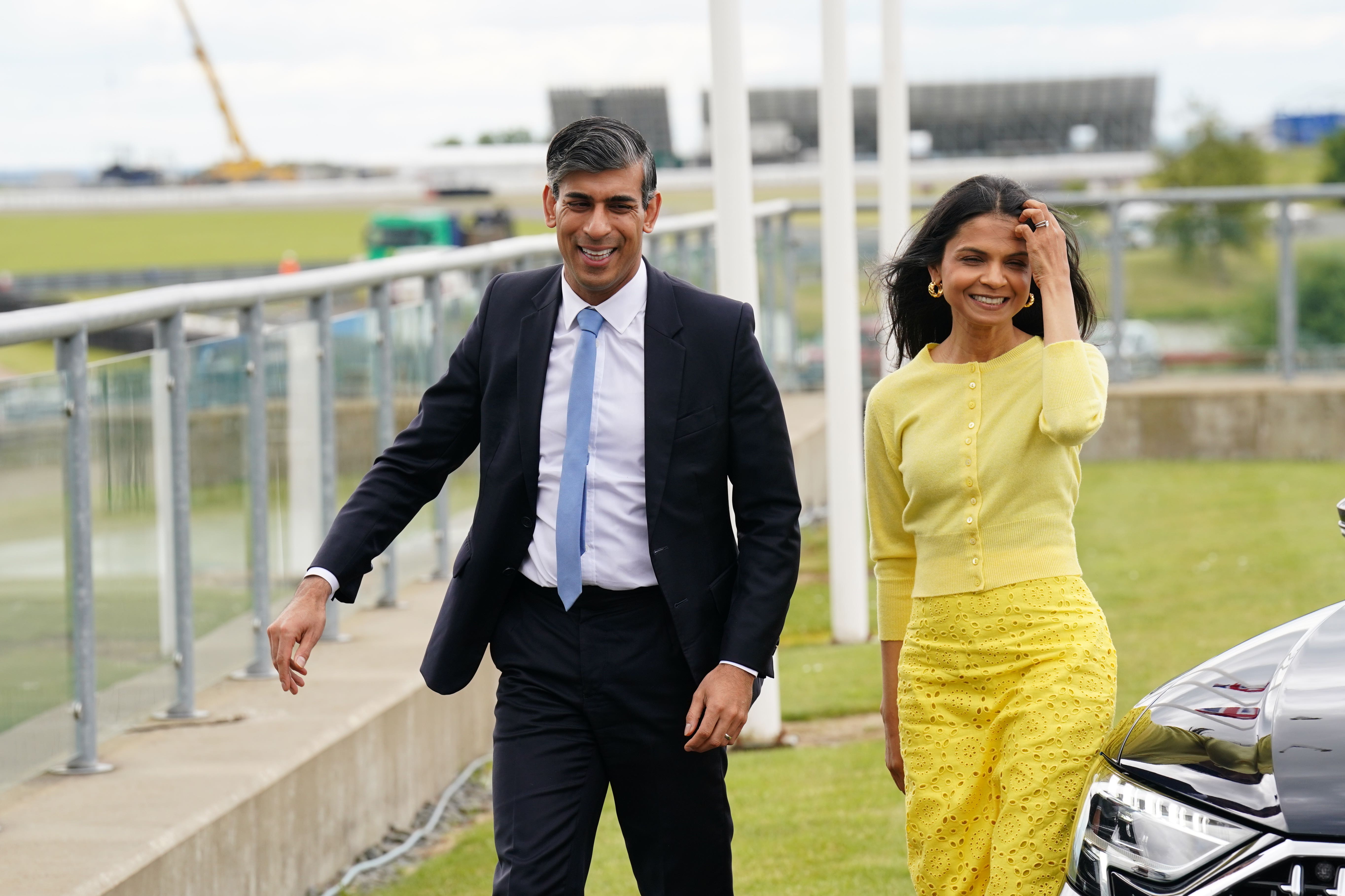 Prime Minister Rishi Sunak and wife Akshata Murty arrive for the launch of the Conservative Party General Election manifesto at Silverstone (James Manning/PA)