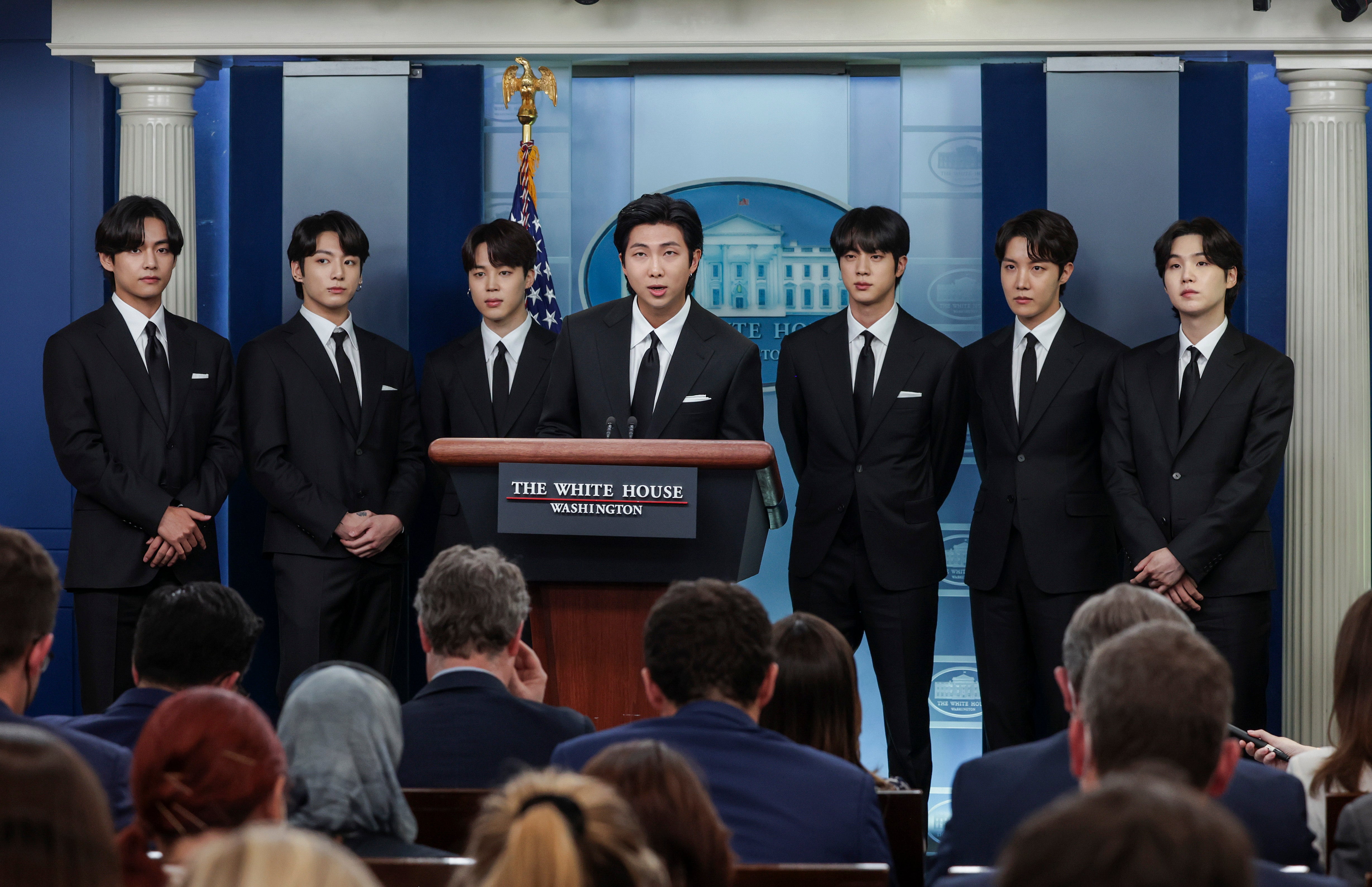 (L-R) V, Jungkook, Jimin, RM, Jin, j-hope and Suga of the South Korean pop group BTS speak at the daily press briefing at the White House on 31 May, 2022 in Washington, DC