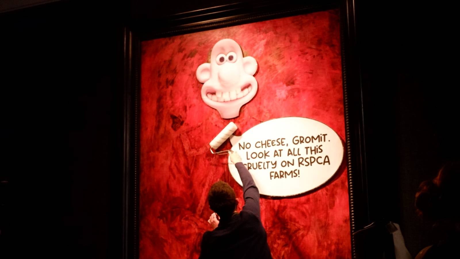 Animal Rising activists plastered Wallace and Gromit-themed posters on the King’s portrait to highlight cruelty on RSPCA-backed farms