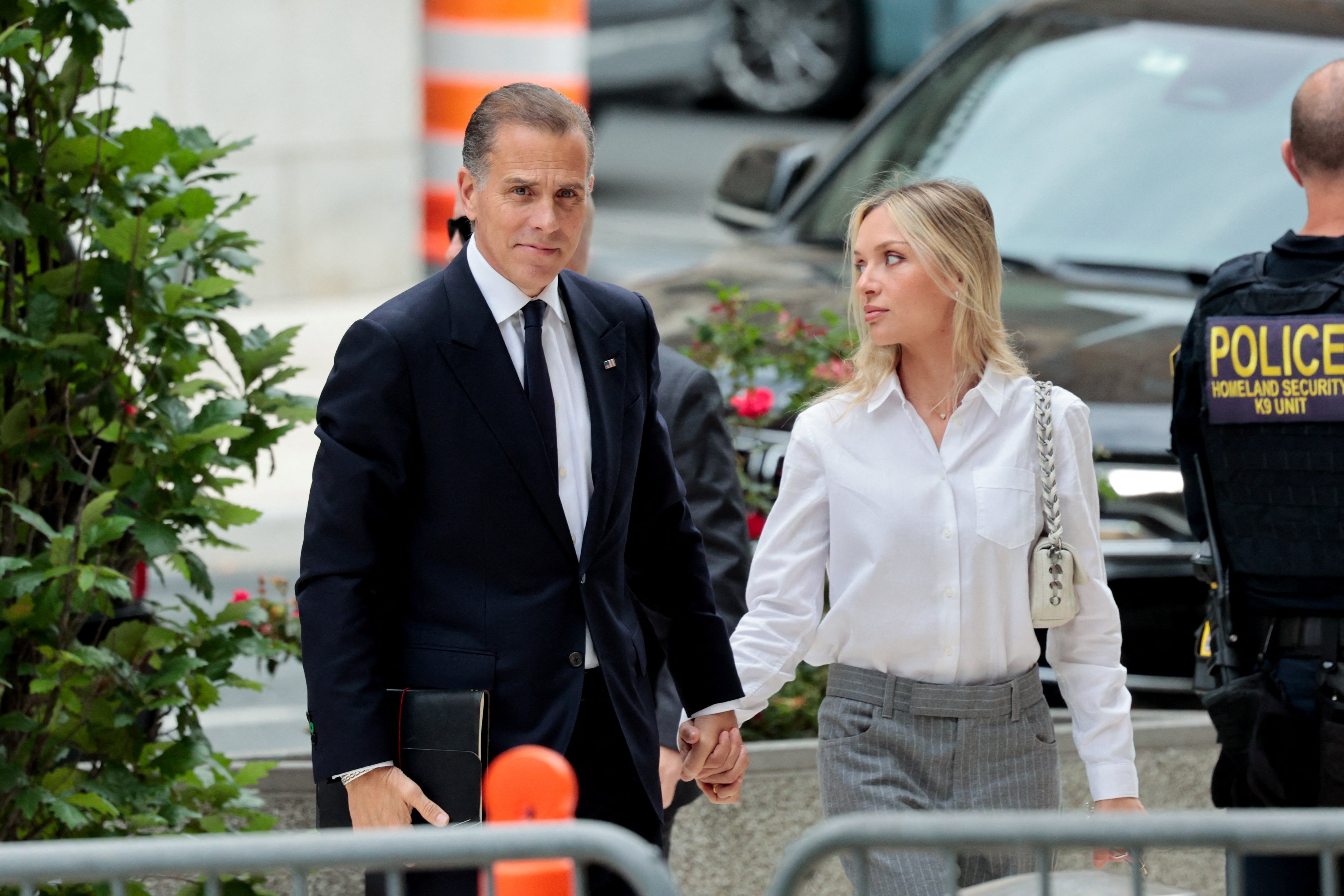 Hunter Biden, son of U.S. President Joe Biden, and his wife Melissa Cohen Biden walk outside the federal court as his trial on criminal gun charges continues, in Wilmington, Delaware, U.S., June 11, 2024