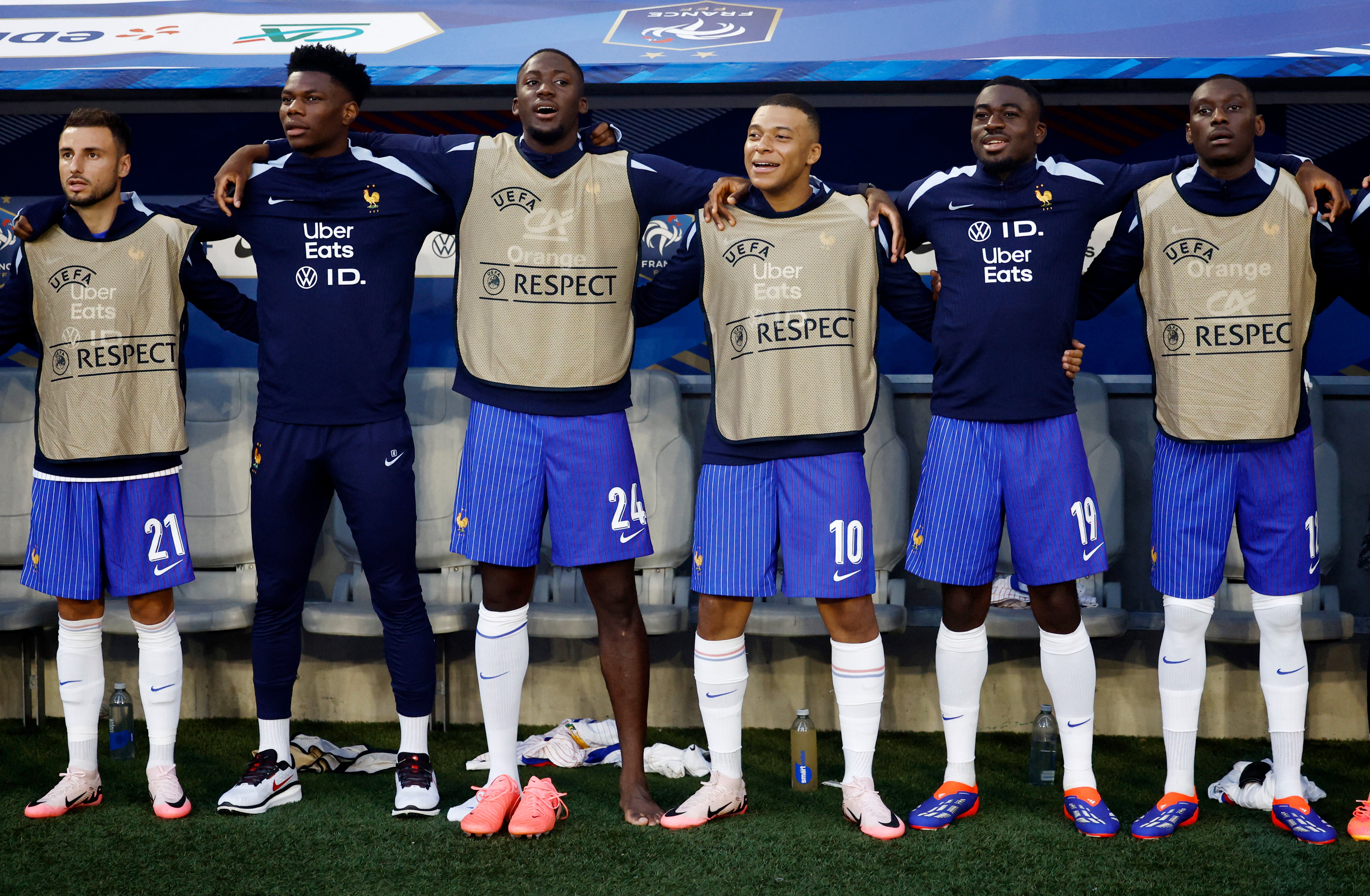 Kylian Mbappe is surrounded by close teammates