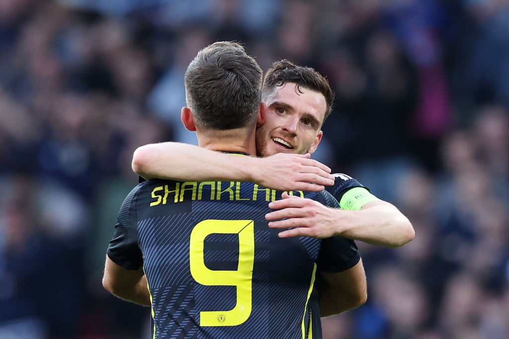 Captain Andy Robertson celebrates with Lawrence Shankland, who scored in the draw against Finland