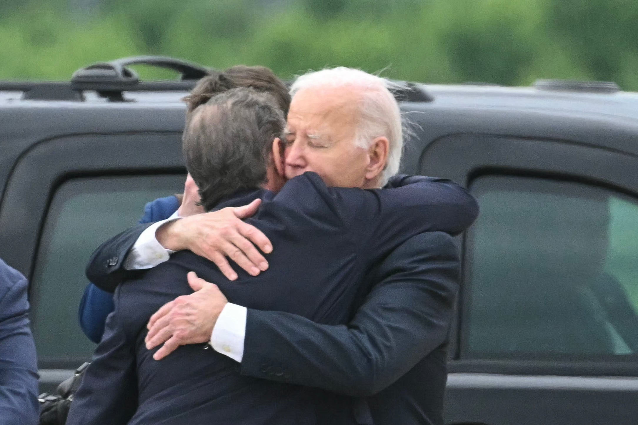 US President Joe Biden hugs his son Hunter Biden upon arrival at Delaware Air National Guard Base in New Castle, Delaware, on June 11, 2024