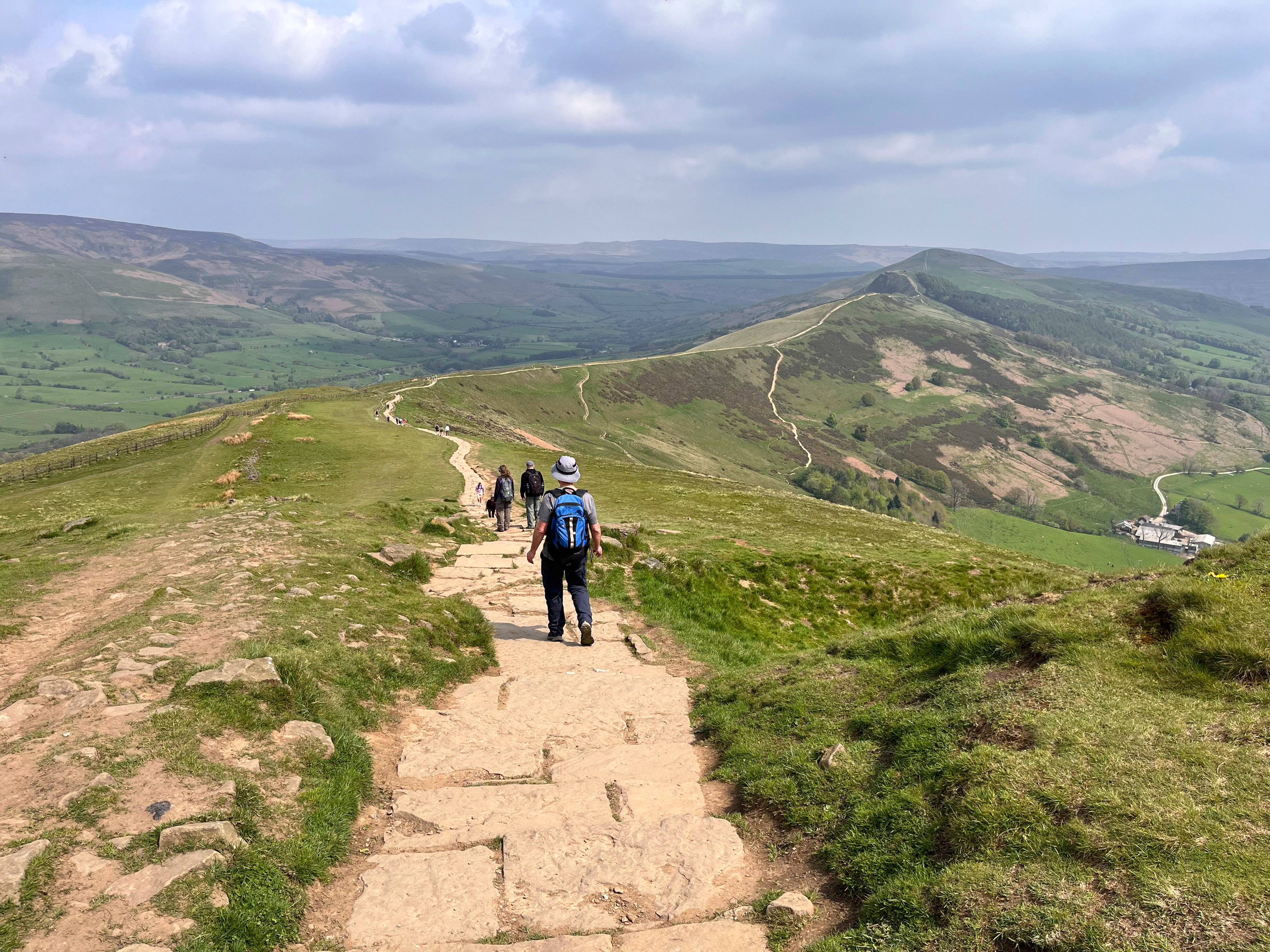 Hikers walk along the Great Ridge in the Peak District National Park