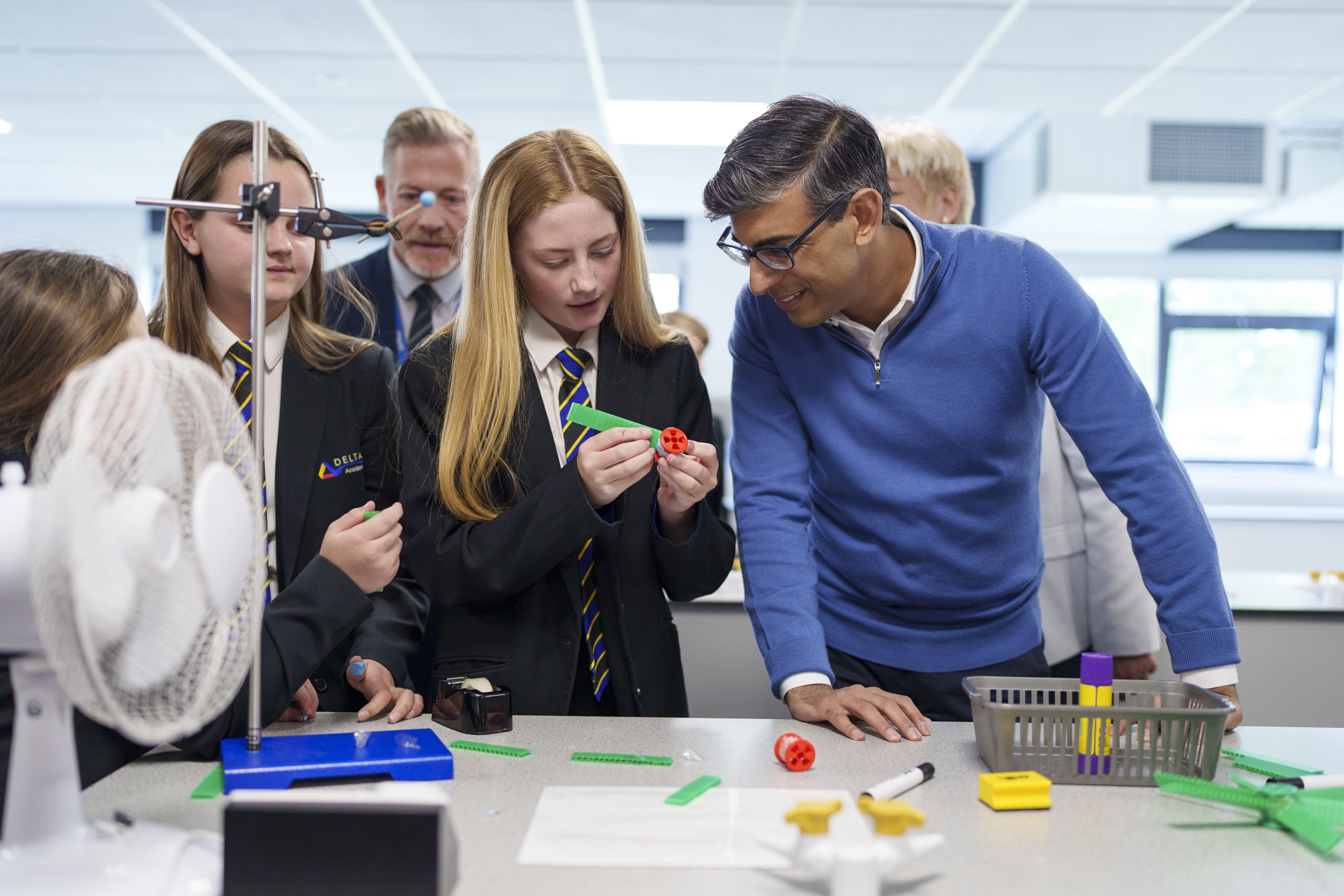 Prime Minister Rishi Sunak speaks to pupils in a science lesson during a visit to John Whitgift Academy in Grimsby (Dominic Lipinski/PA)