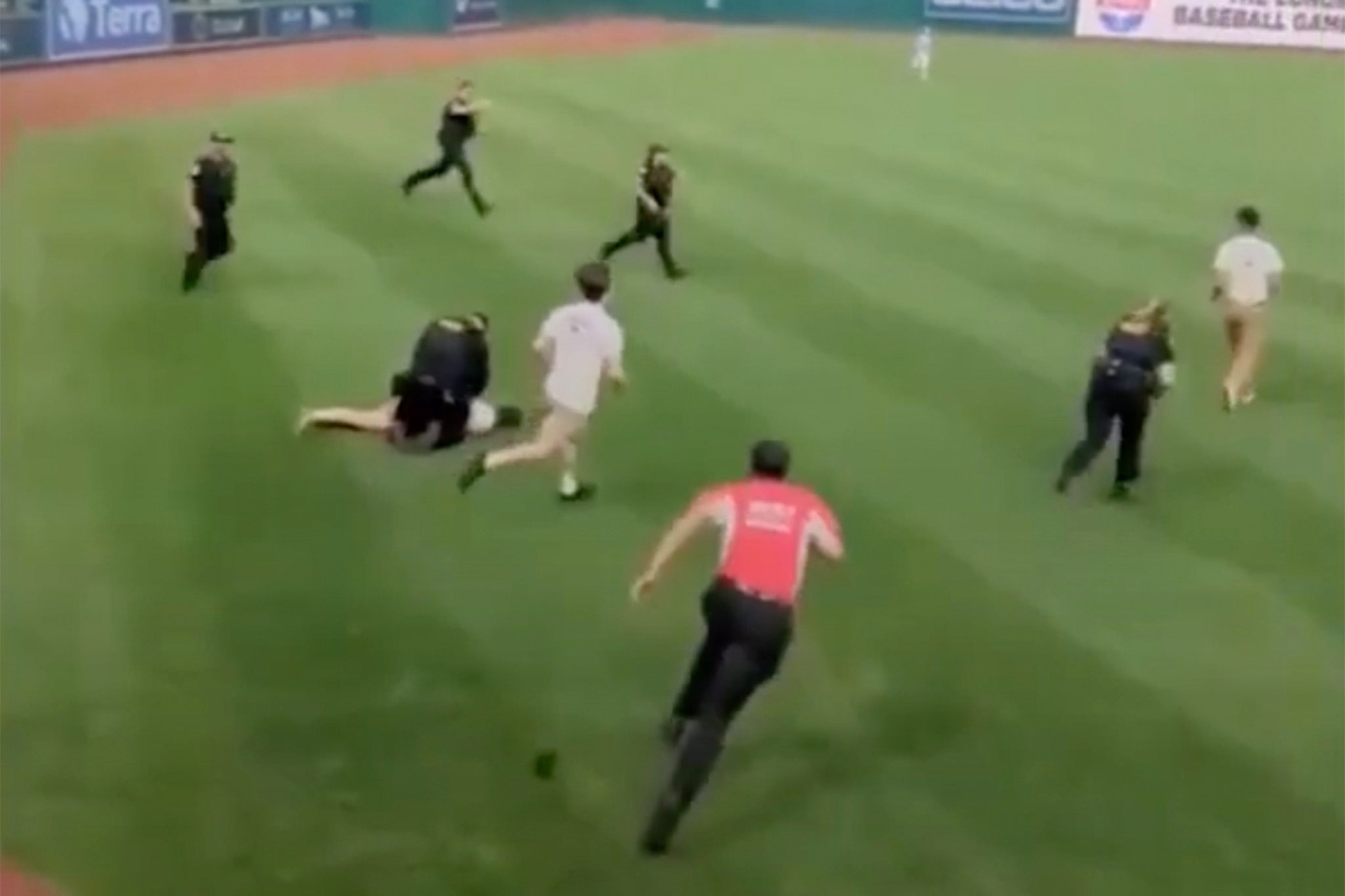 Police swarmed the activists as they hopped onto the field in the second inning