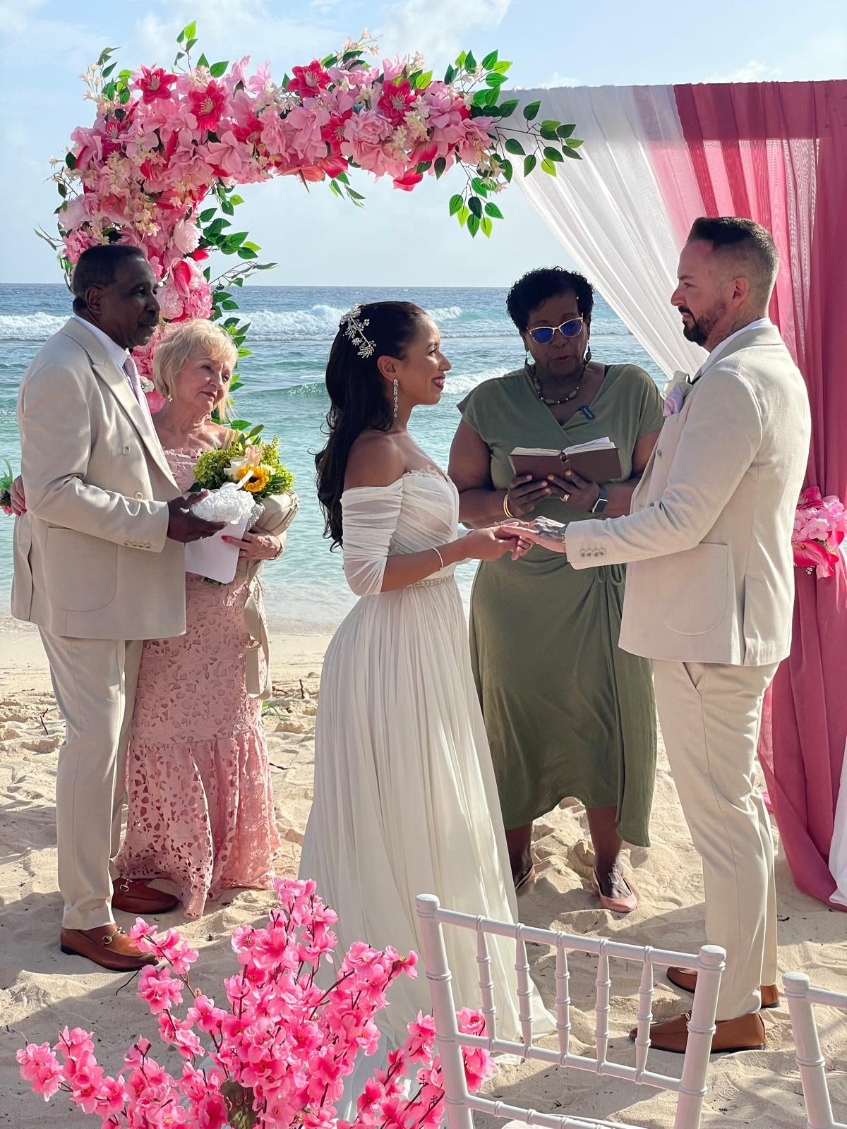 Victoria and Adam Blakey exchanging vows at their wedding in Barbados (Collect/PA Real Life)