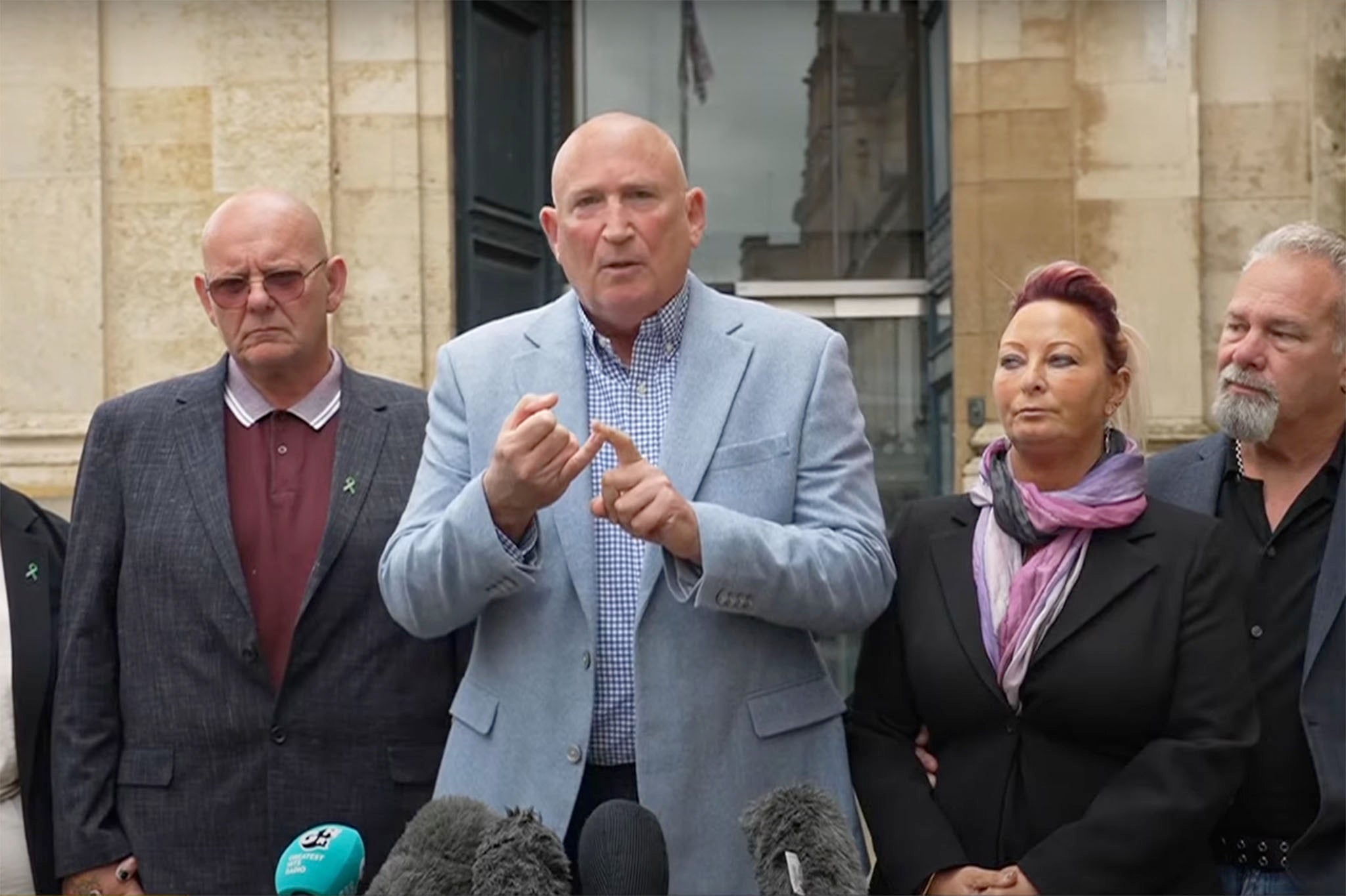 Dunn family spokesperson Radd Seiger (centre) with Harry’s relatives