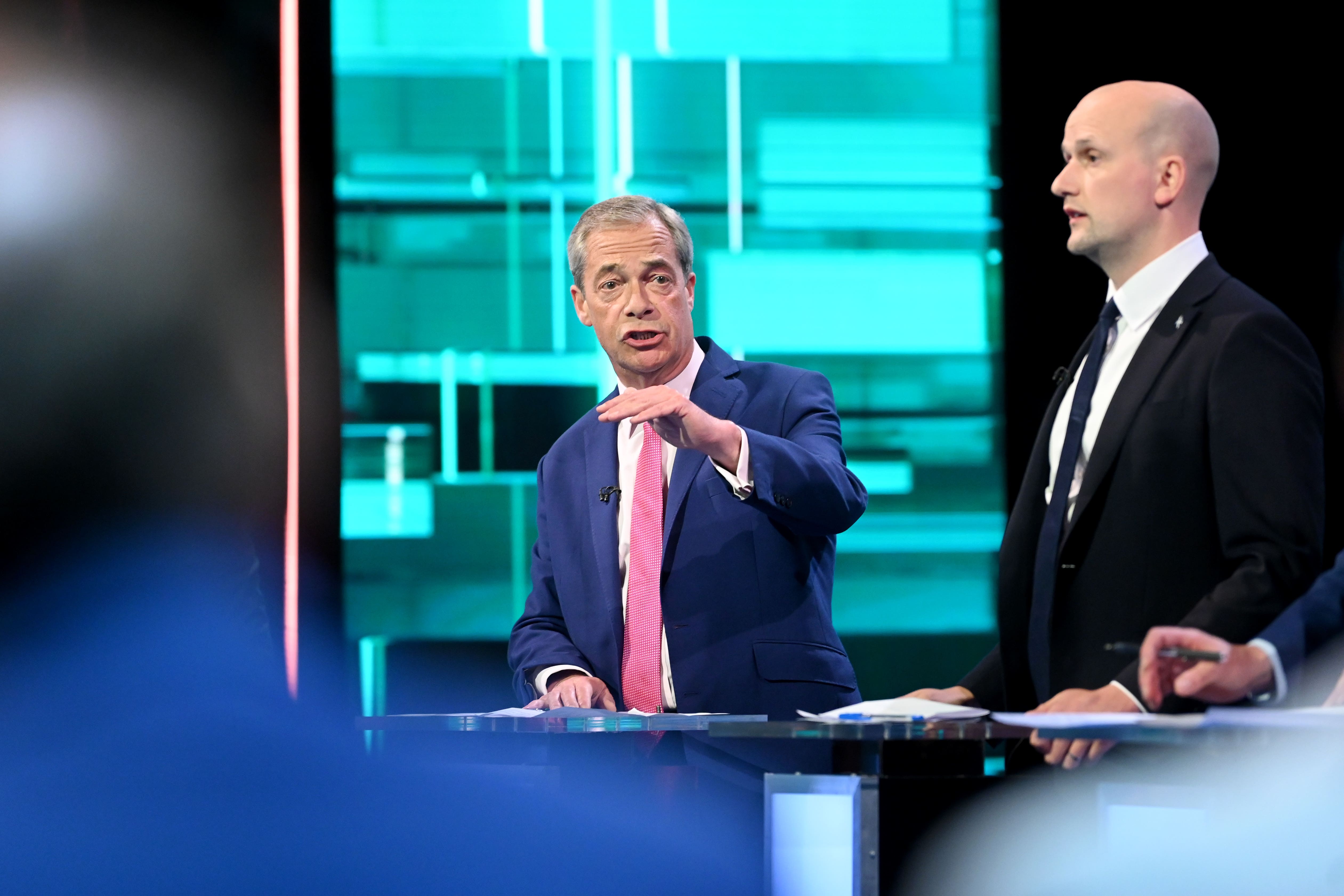 Reform UK leader Nigel Farage and Stephen Flynn of the SNP taking part in the ITV debate (Jonathan Hordle/ITV/PA)