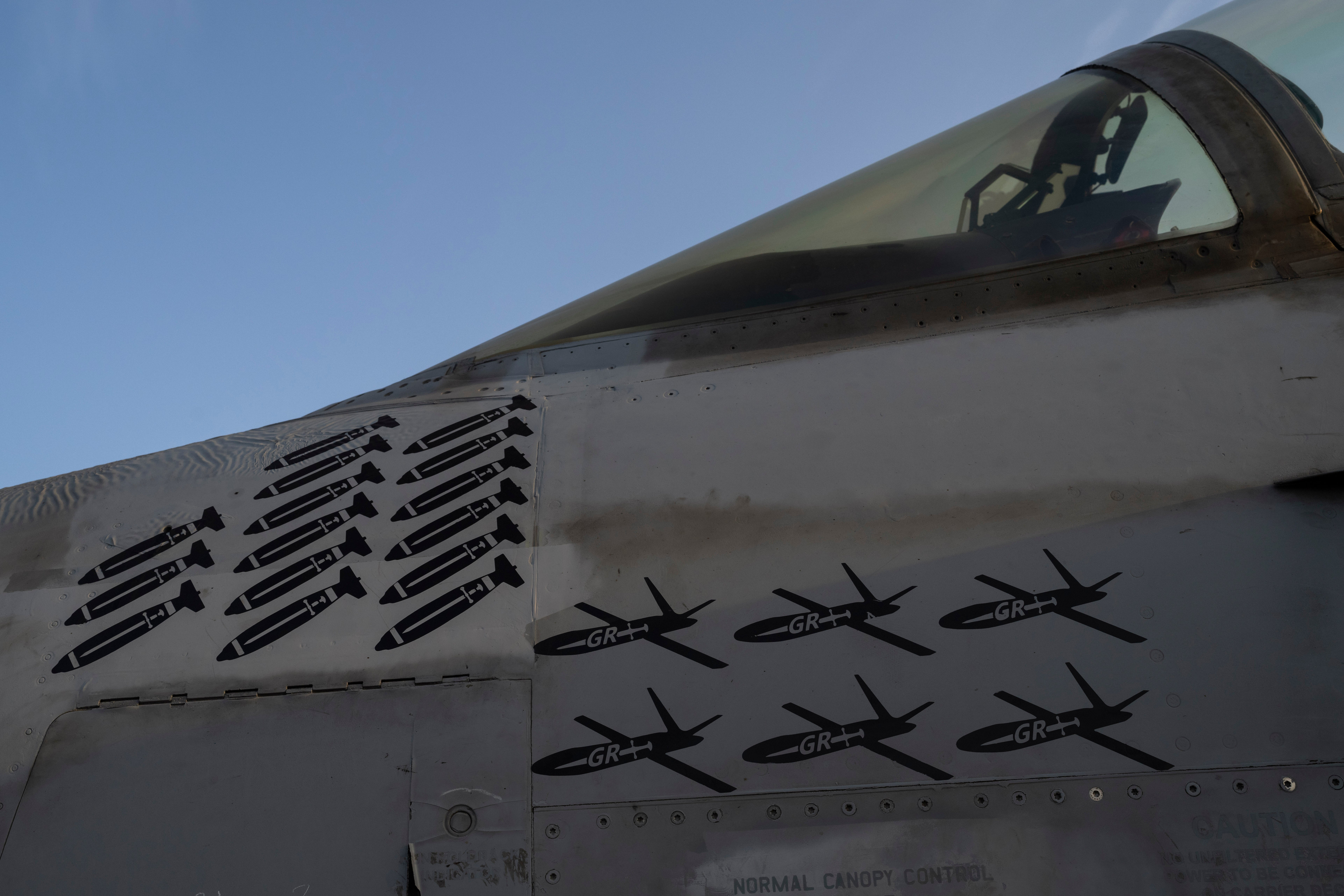 Drawings of drones and missiles that have been shot down are painted on the fuselage of a fighter jet