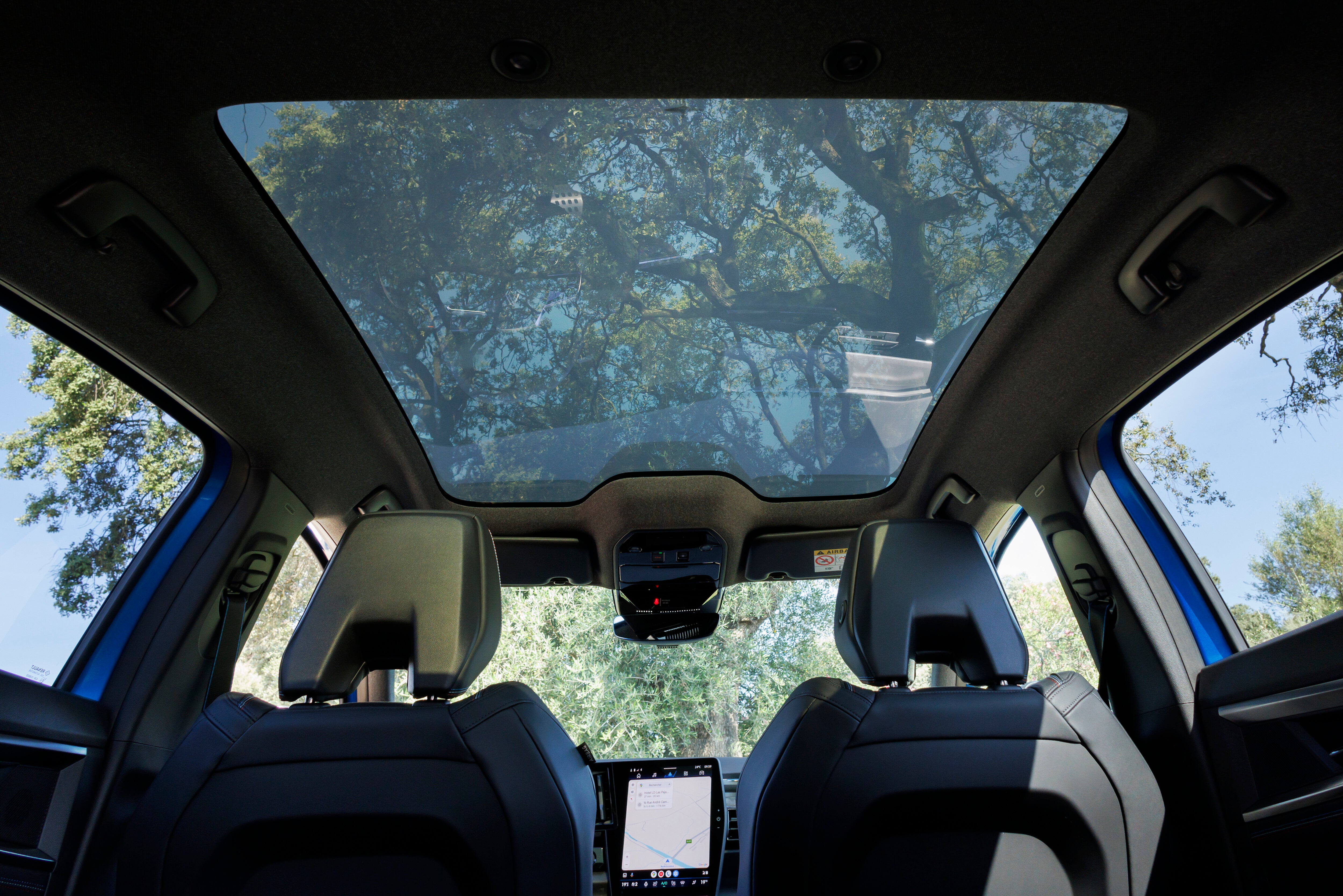 The large panoramic glass roof darkens and lightens via voice or manual control