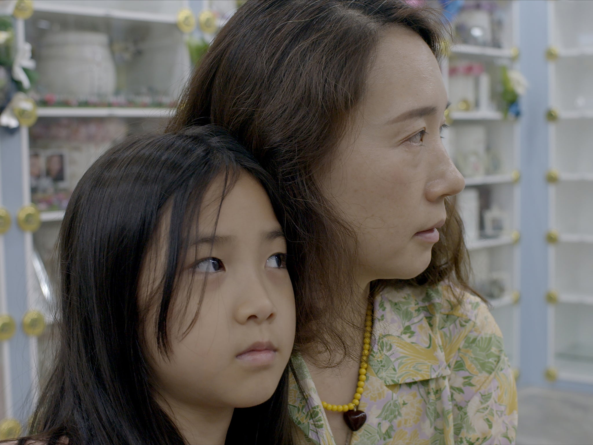 Jang Ji-Sung, pictured with one of her children, has been using AI to get closure after her daughter’s death