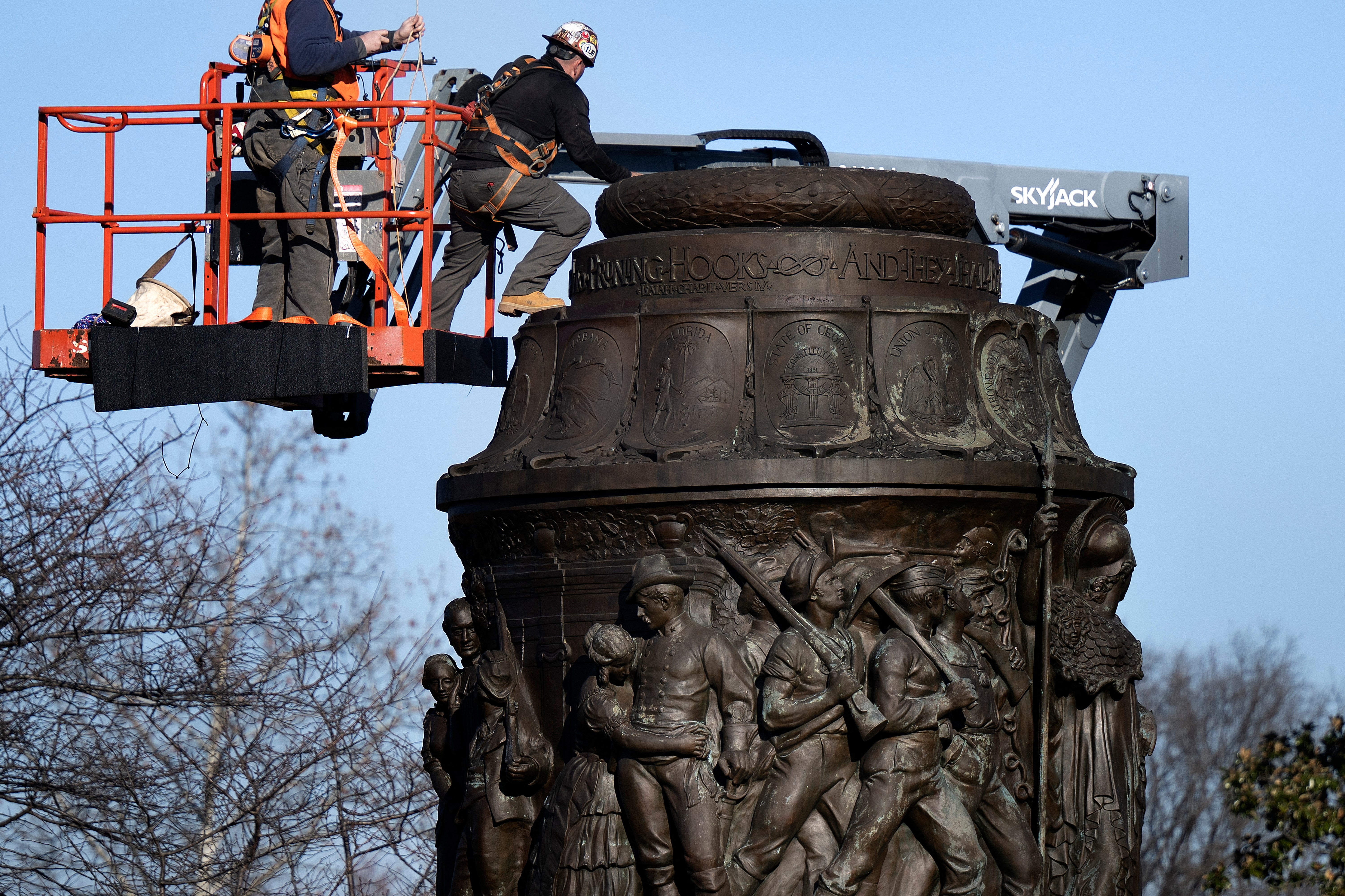 Workers dismantle the Confederate Memorial at Arlington National Cemetery December 20, 2023, in Arlington, Virginia