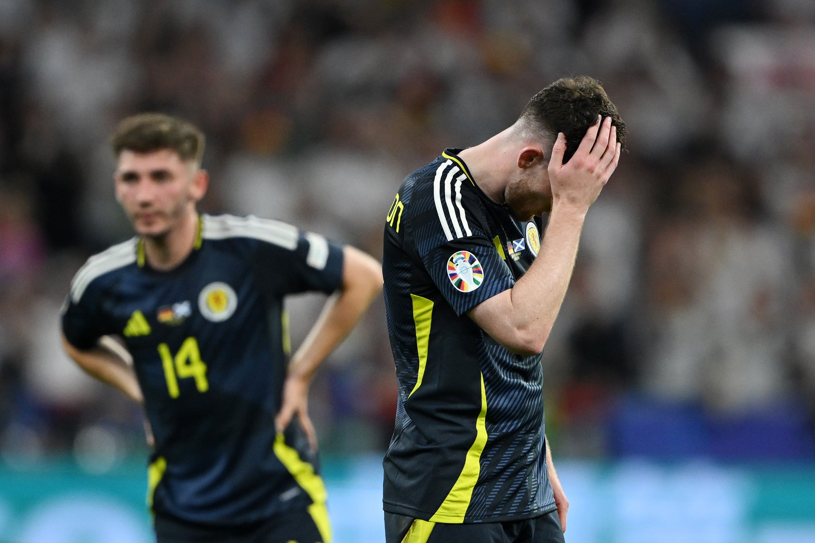 Andy Robertson of Scotland looks dejected after defeat to Germany