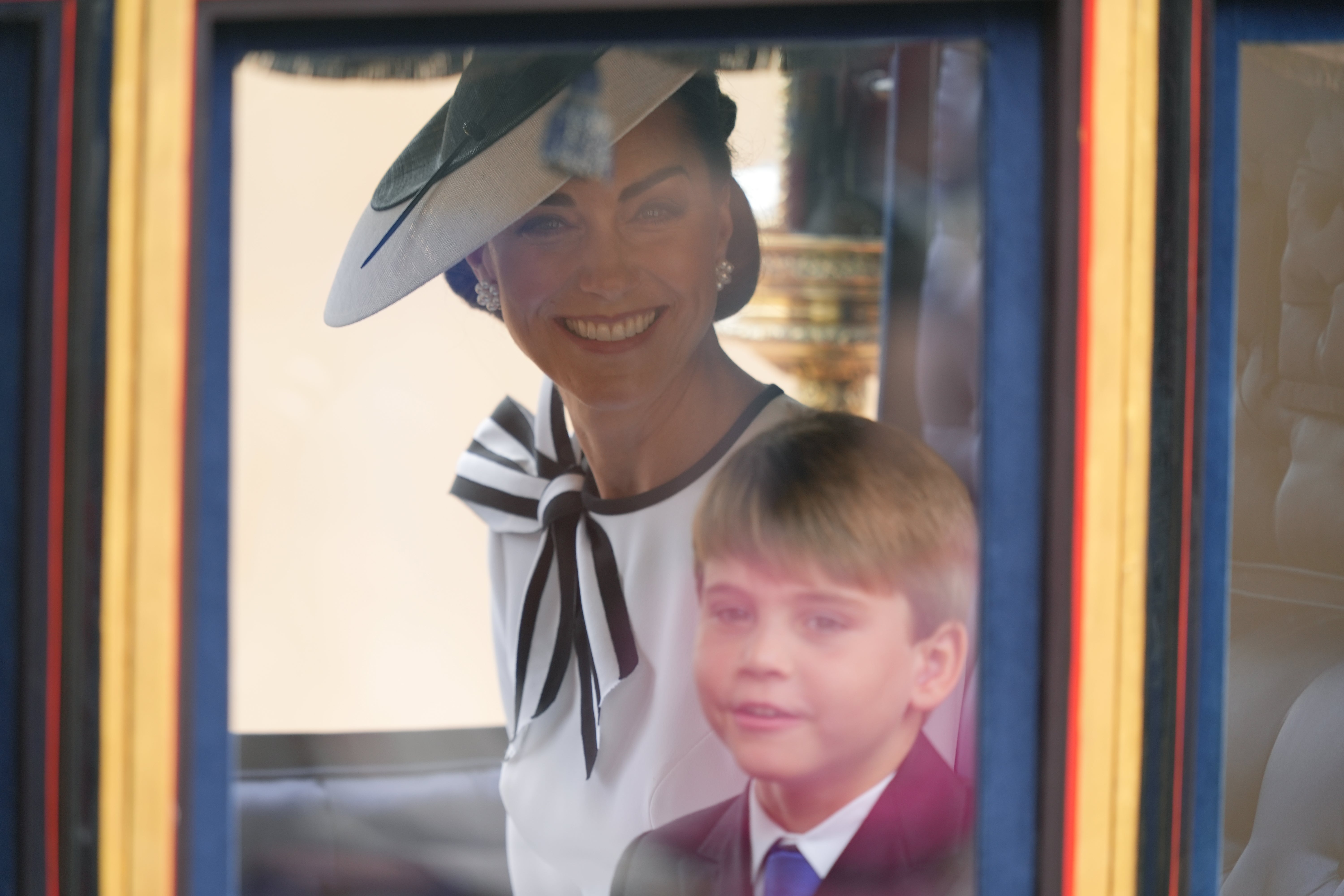 The princess was seen smiling in her carriage alongside her son Louis