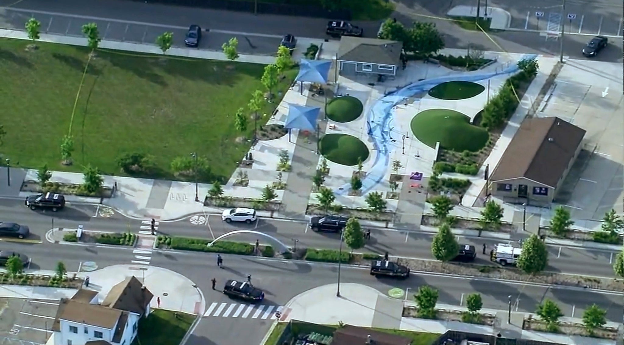 Police respond to the scene of a shooting at the Brooklands Plaza Splash Pad, Saturday, June 15, 2024, in Rochester Hills, Mich