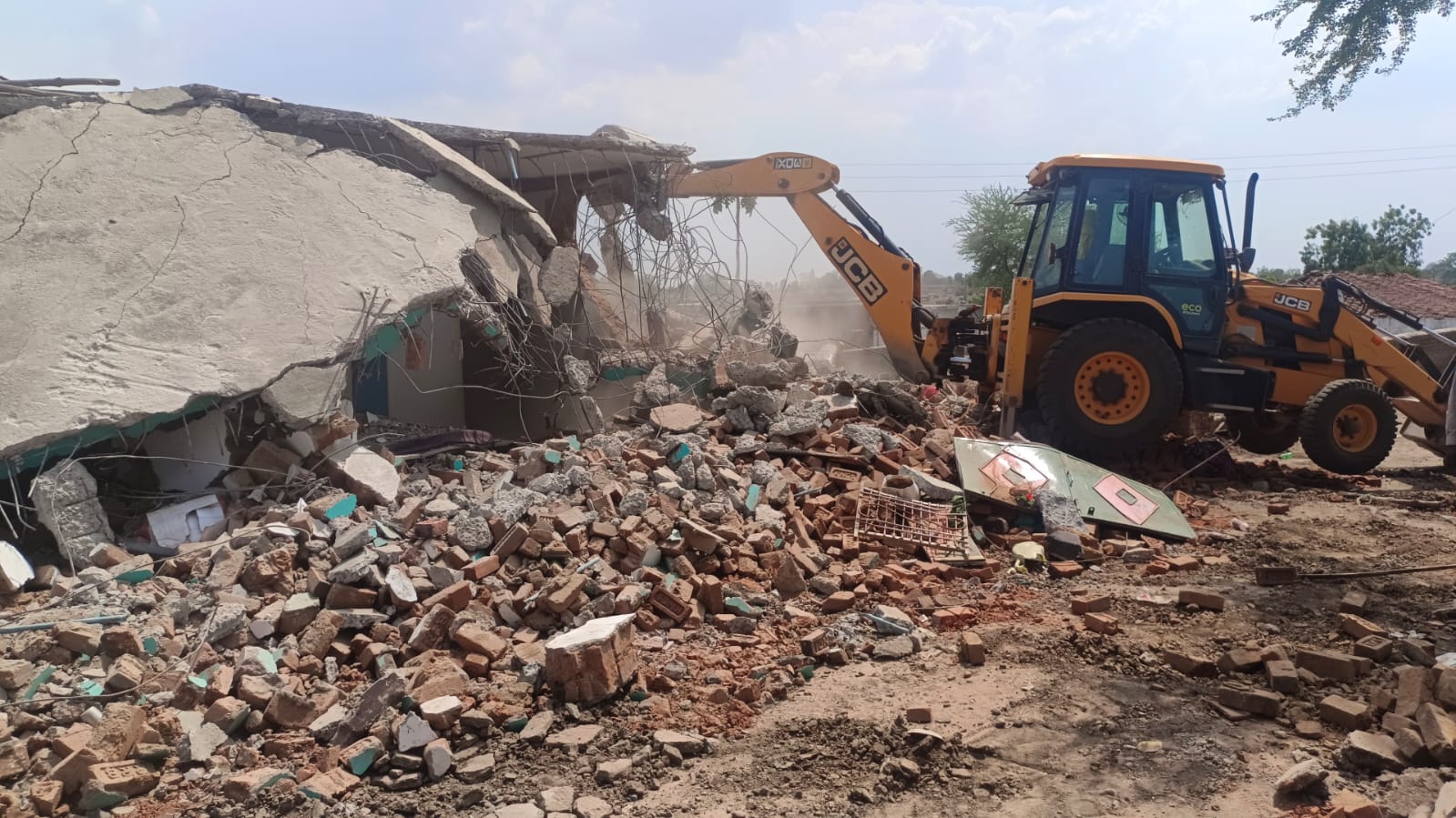 Photos shared by Madhya Pradesh police show the homes being razed