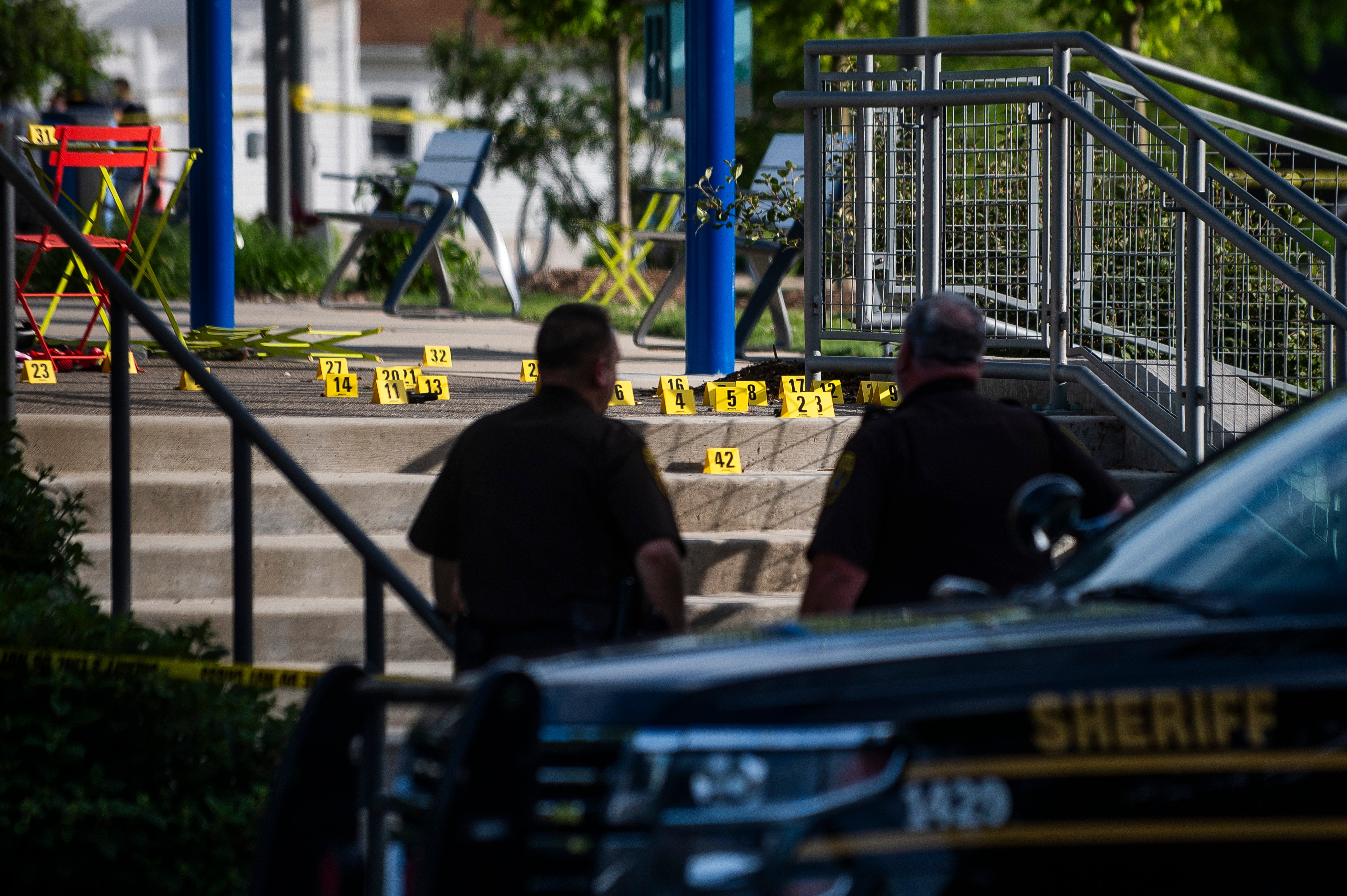 Officials with the Oakland County Sheriff’s Department, Rochester Hills Fire Department and other jurisdictions secure the scene of a shooting at the Brooklands Plaza Splash Pad, Saturday